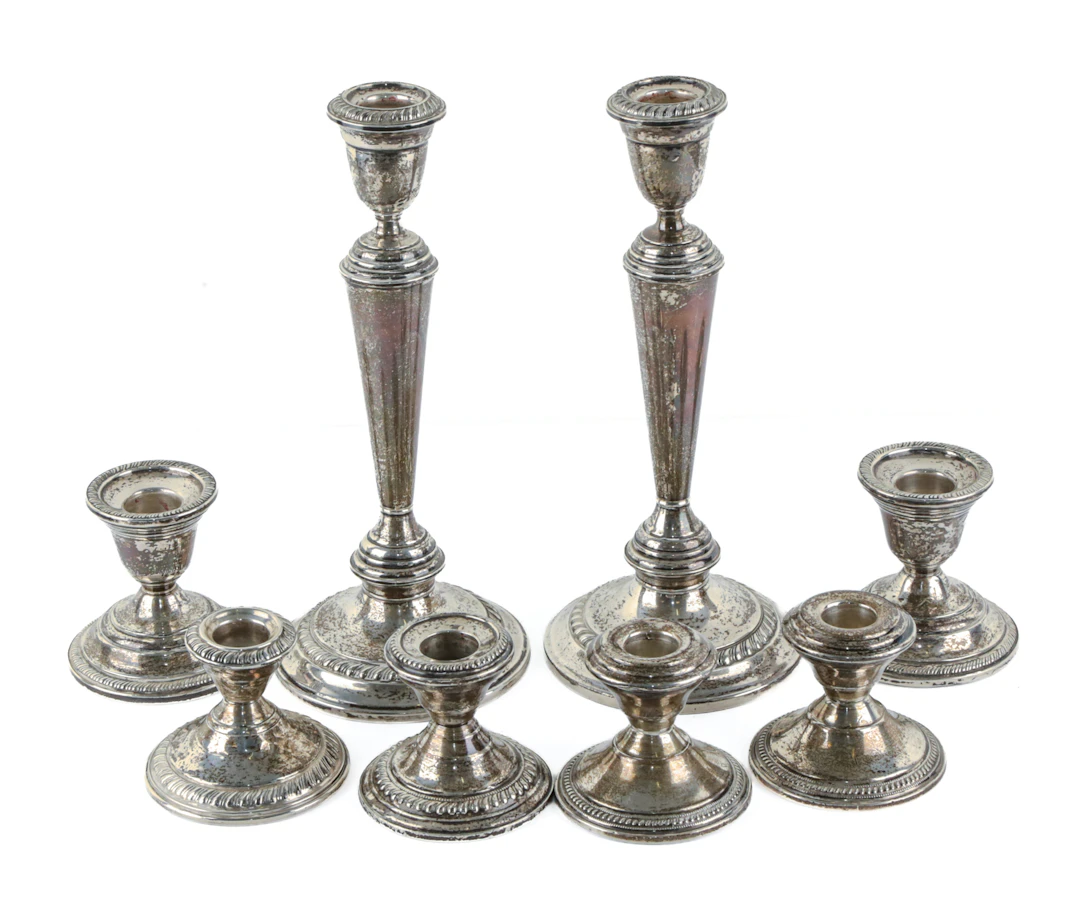 Eight Weighted Sterling Candlesticks