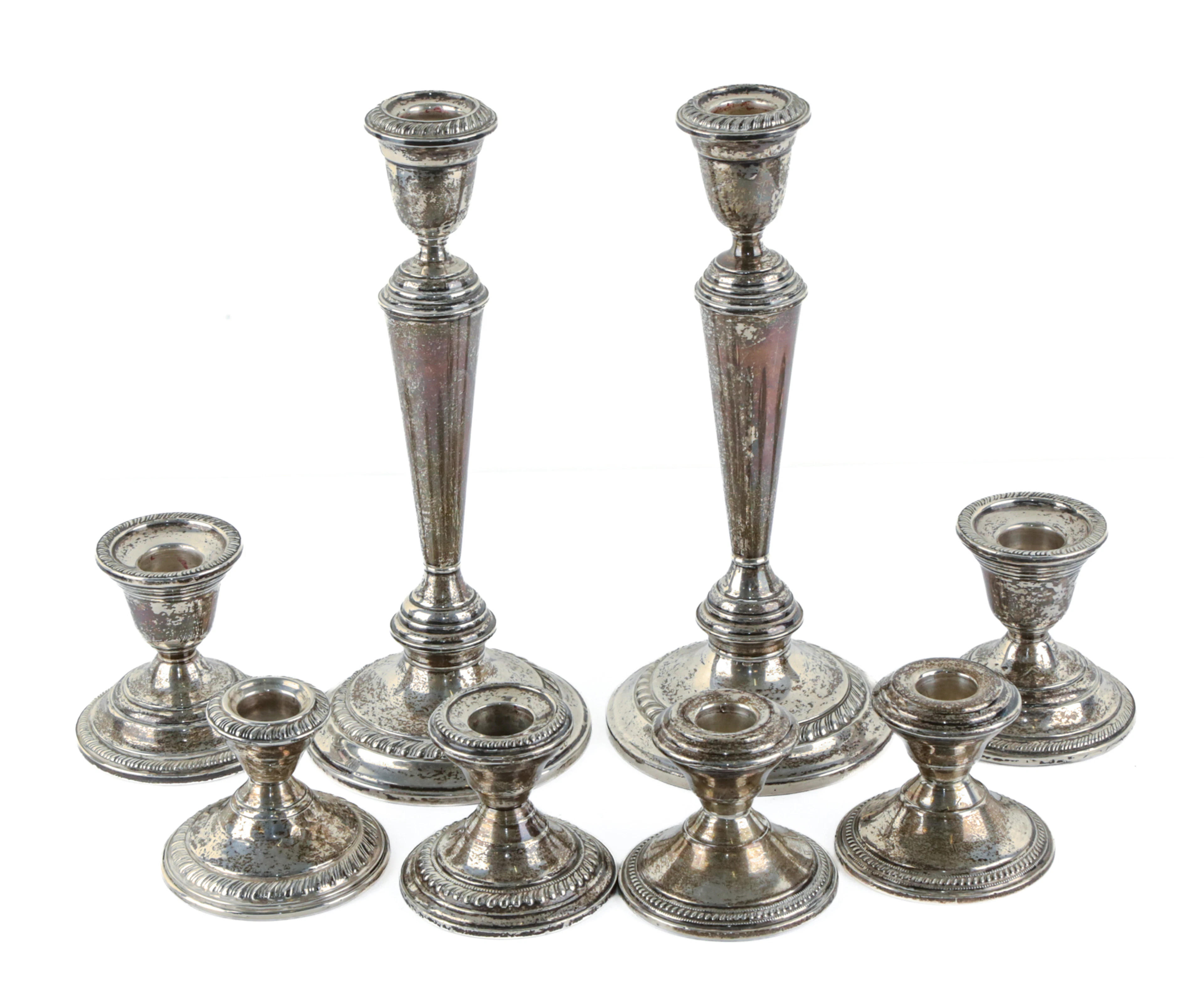 Eight Weighted Sterling Candlesticks