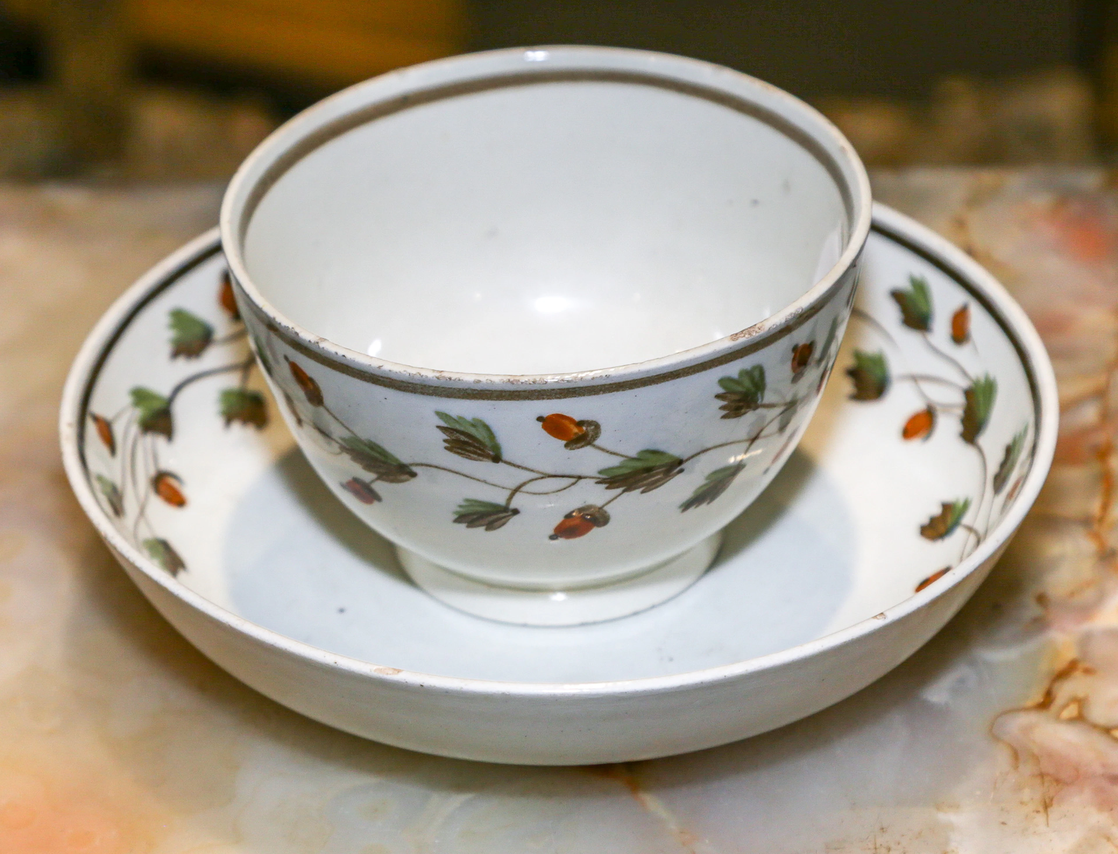 An English Painted Pearlware Tea Bowl & Saucer