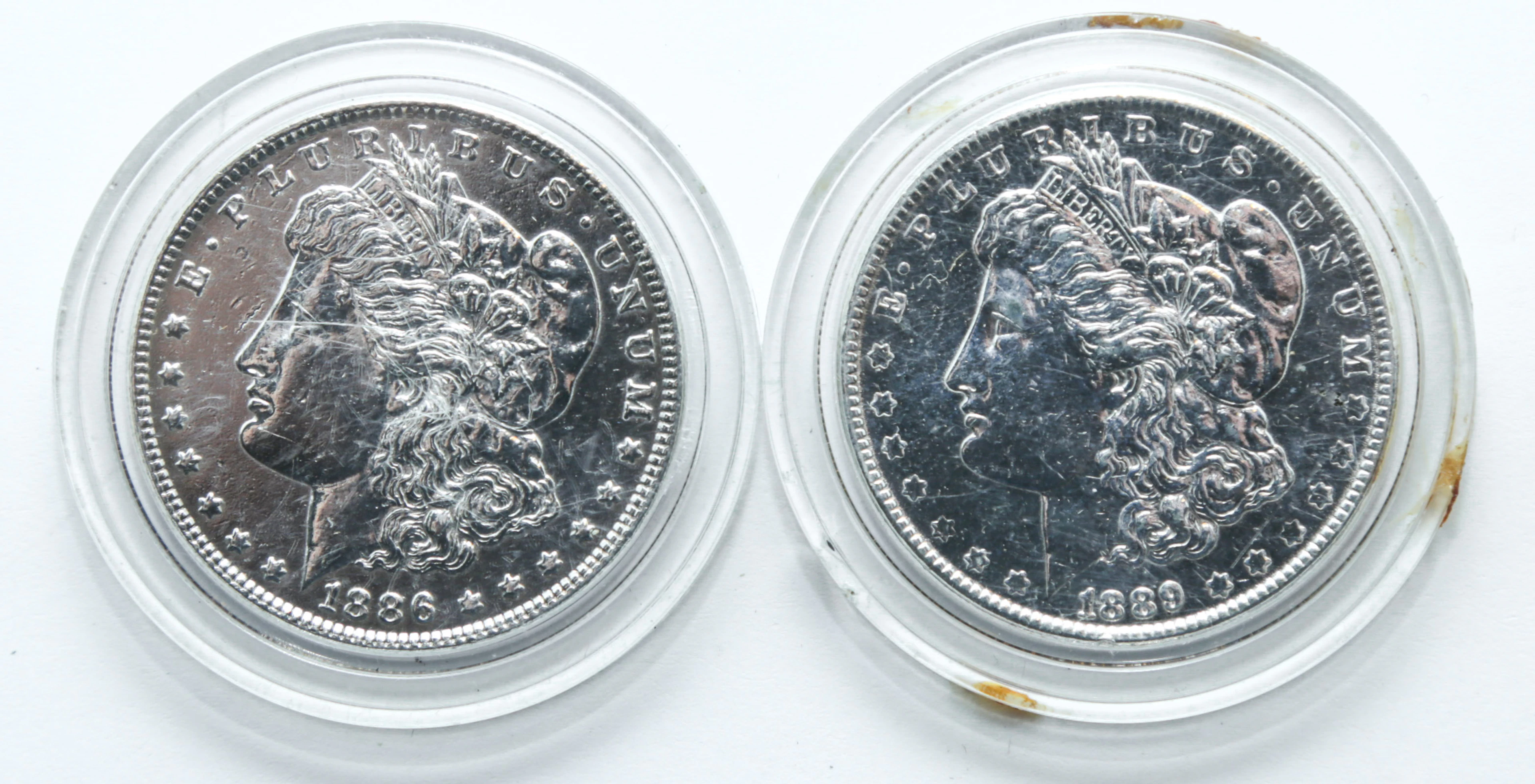 A Pair of Polished Morgan Dollars