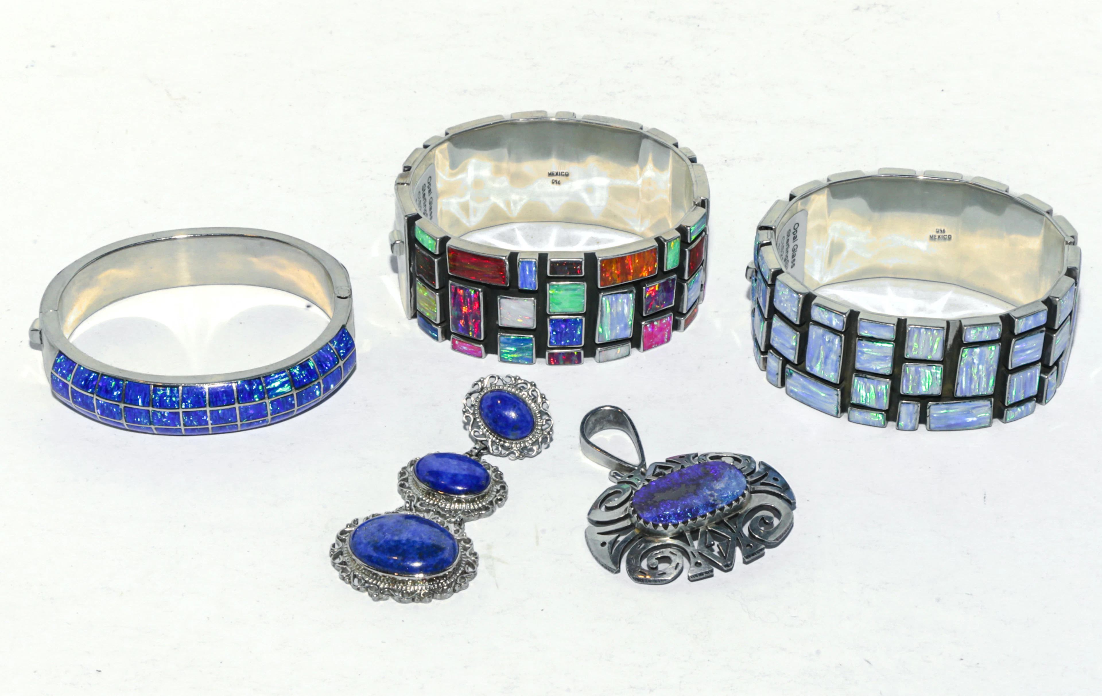 Trio of Bangles & Two Pendants in Sterling Silver