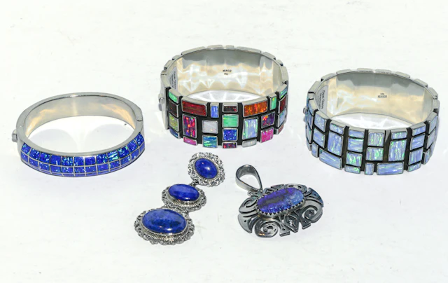 Trio of Bangles & Two Pendants in Sterling Silver