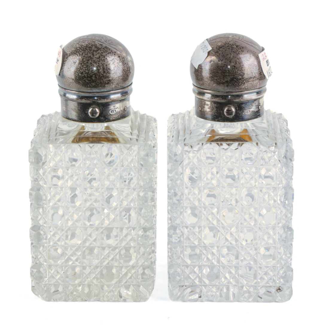 A Pair of English Sterling-Mounted Cut Crystal Bottles