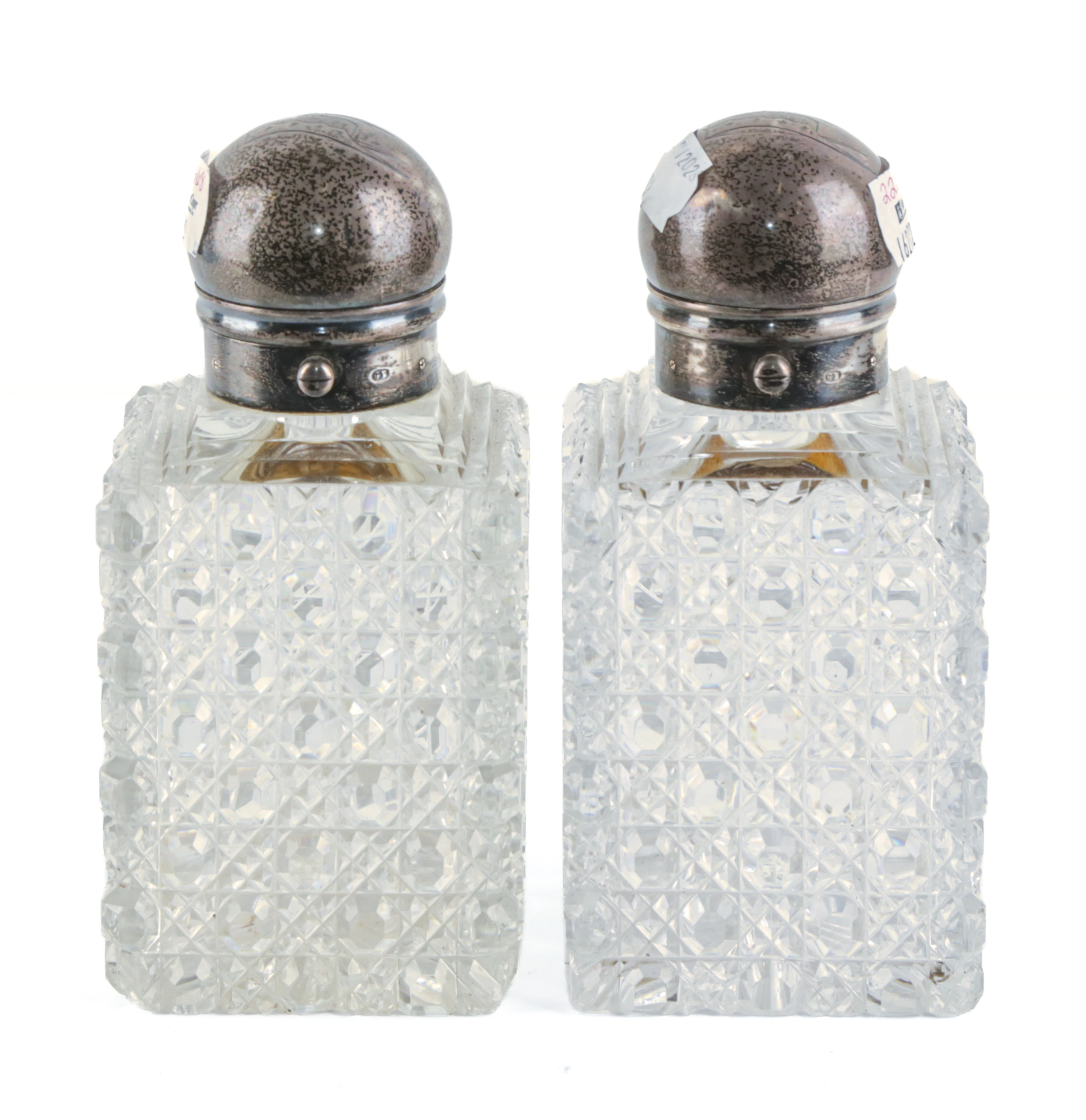 A Pair of English Sterling-Mounted Cut Crystal Bottles