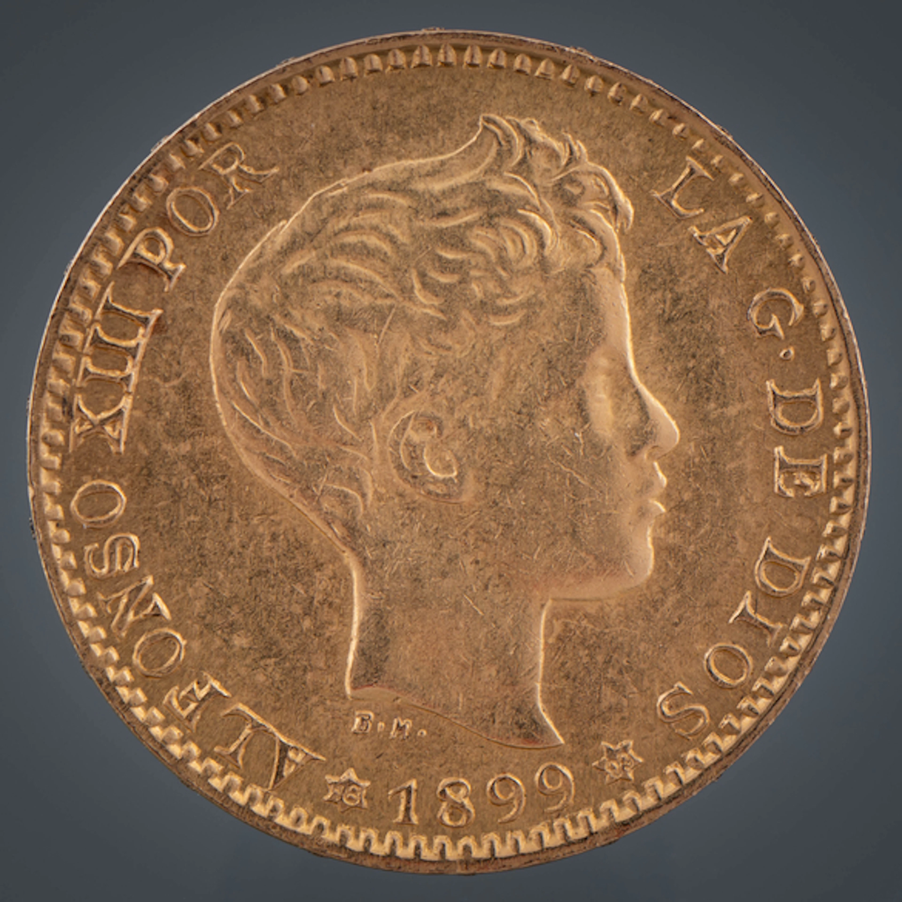 Moneda de veinte pesetas de Alfonso XIII en oro de 22kt del año 1899.