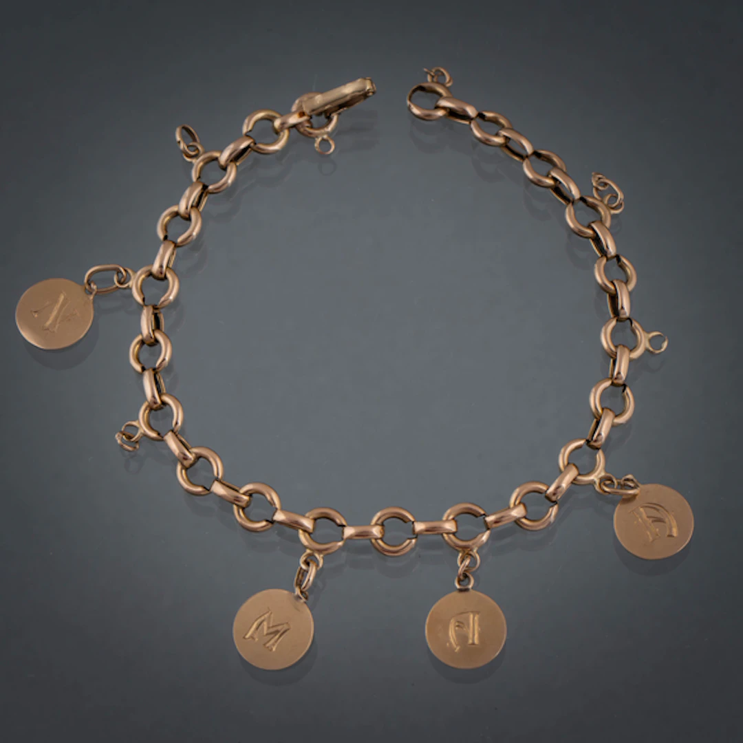 Cadena de eslabones en oro amarillo de 18 kt con cuatro medallas con