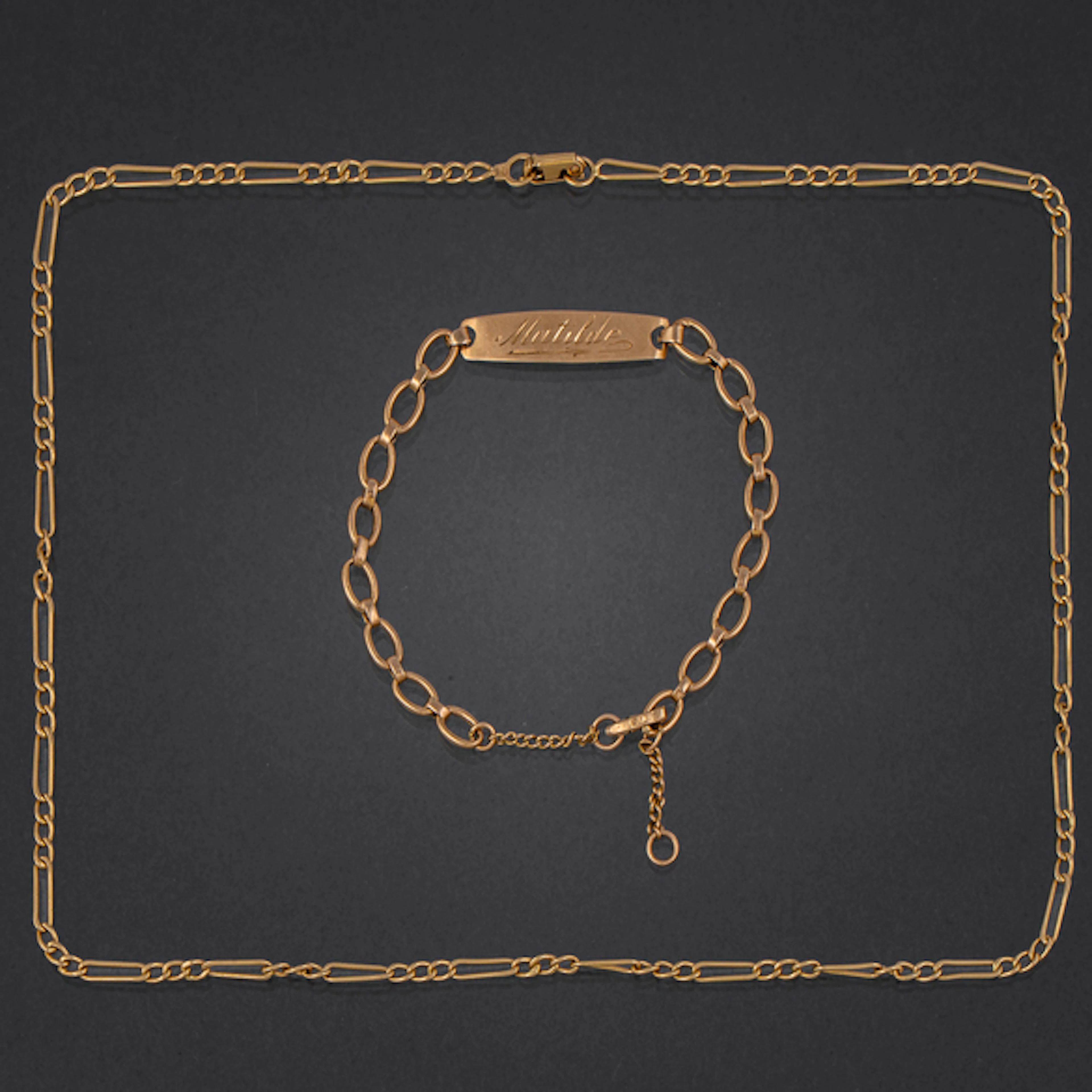 Conjunto de cadena y pulsera de eslabones en oro amarillo de 18 kt.