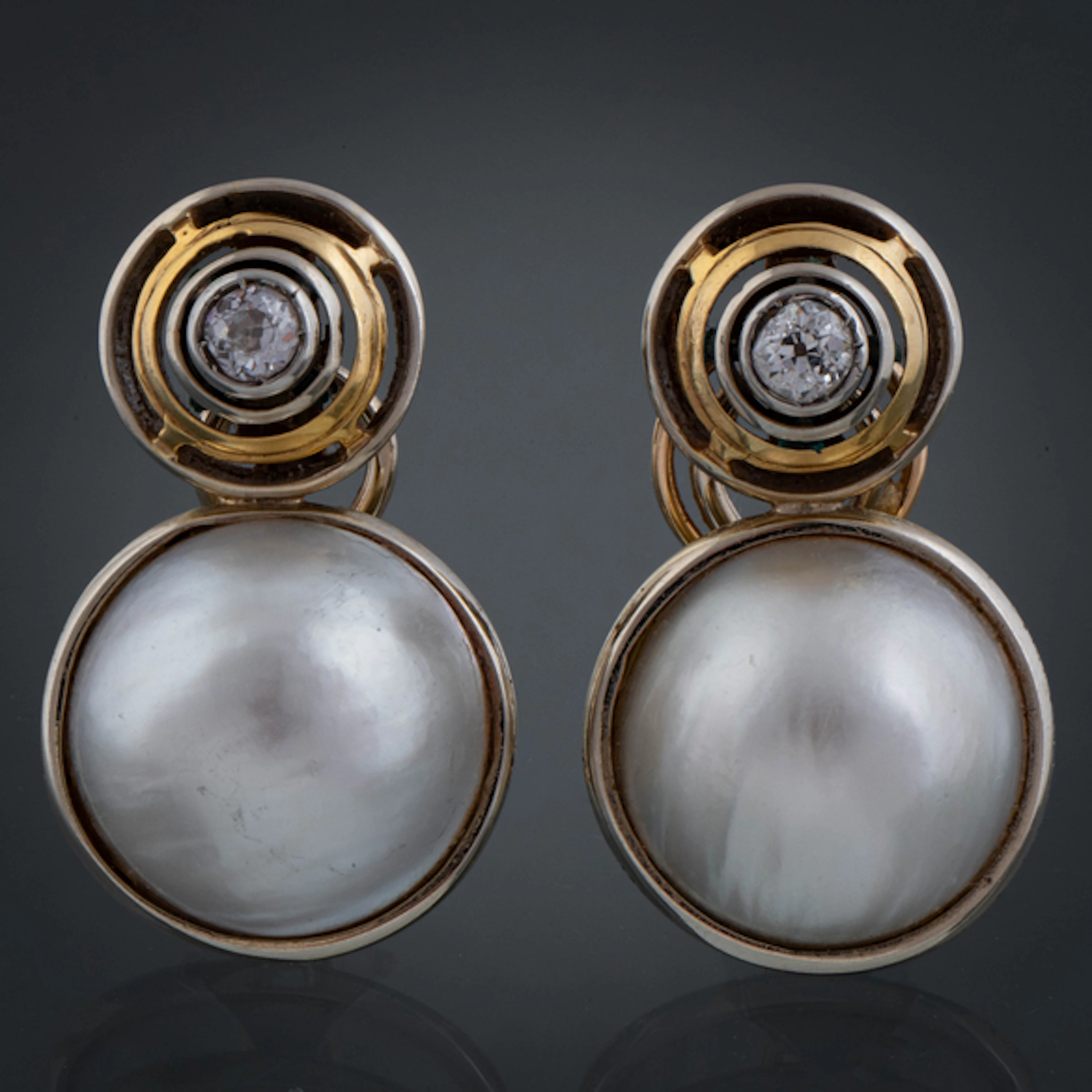 Pareja de pendientes largos en oro amarillo y oro blanco de 18 kt