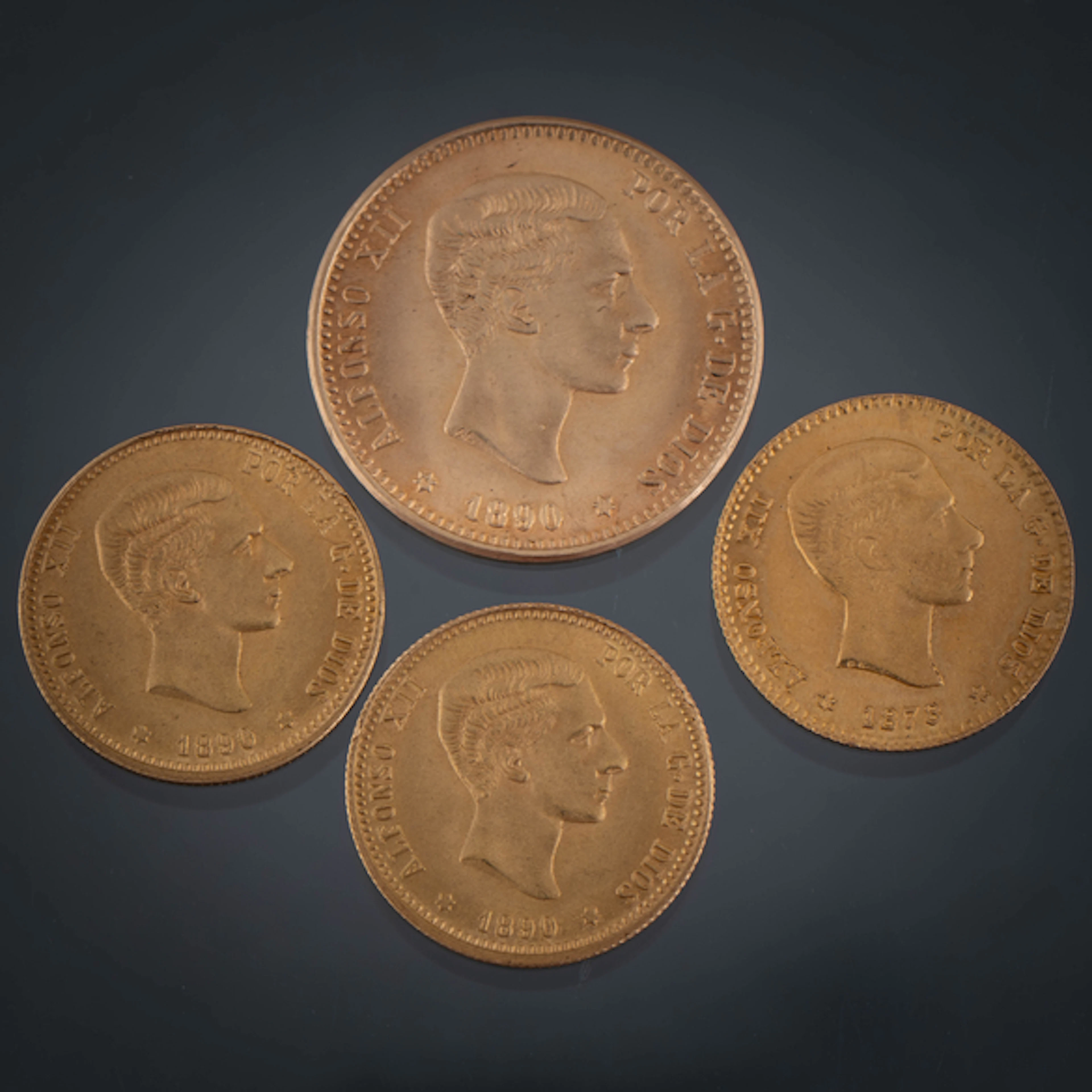 Conjunto de cuatro monedas de Alfonso XII en oro de 22 kt