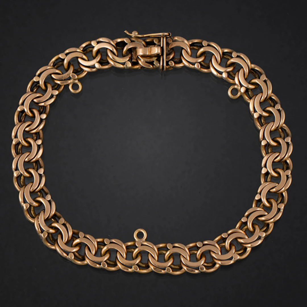 Pulsera de doble eslabón barbado en oro amarillo de 18 kt.