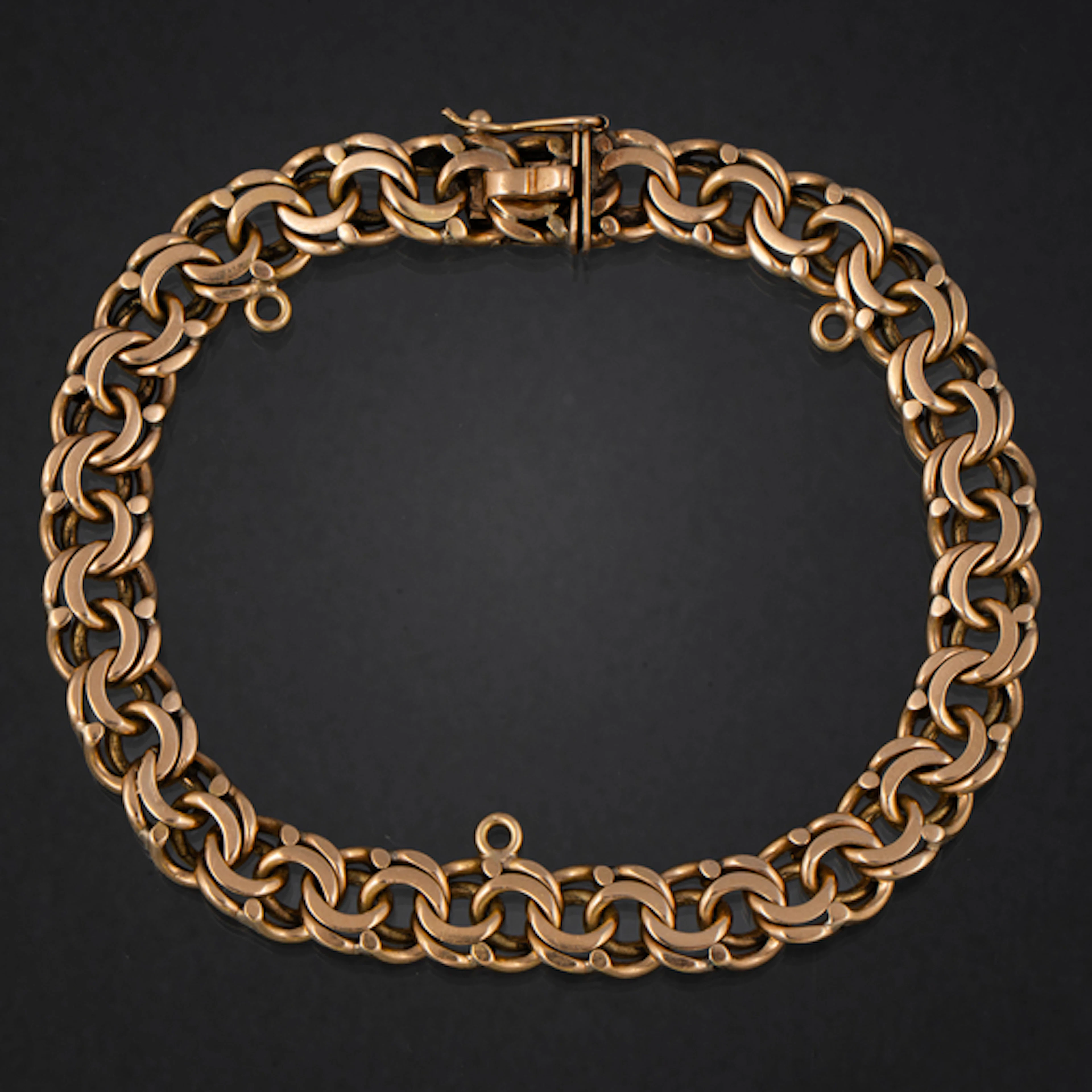 Pulsera de doble eslabón barbado en oro amarillo de 18 kt.