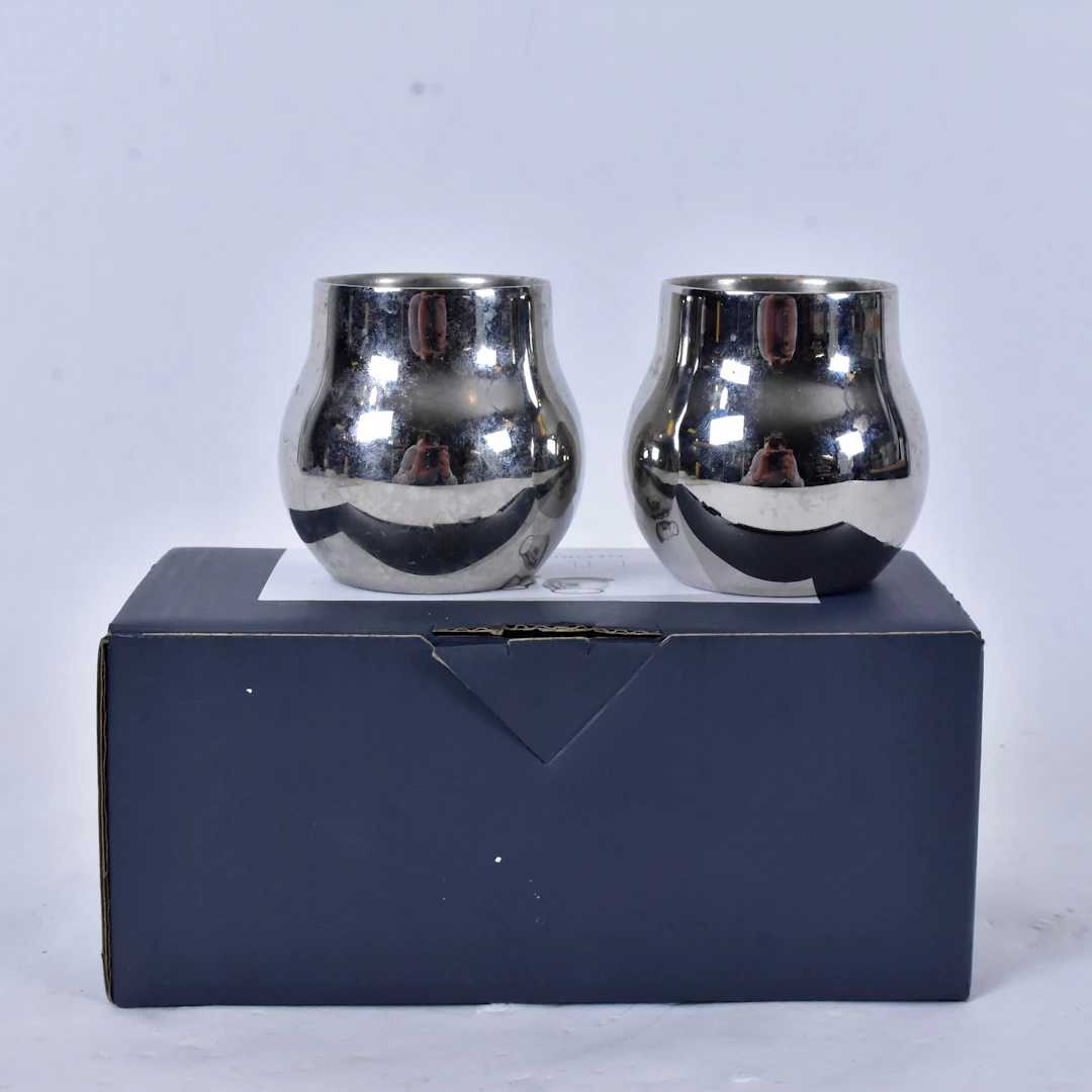 GEORG JENSEN. ljuslyktor, 1 par, rostfritt stål.