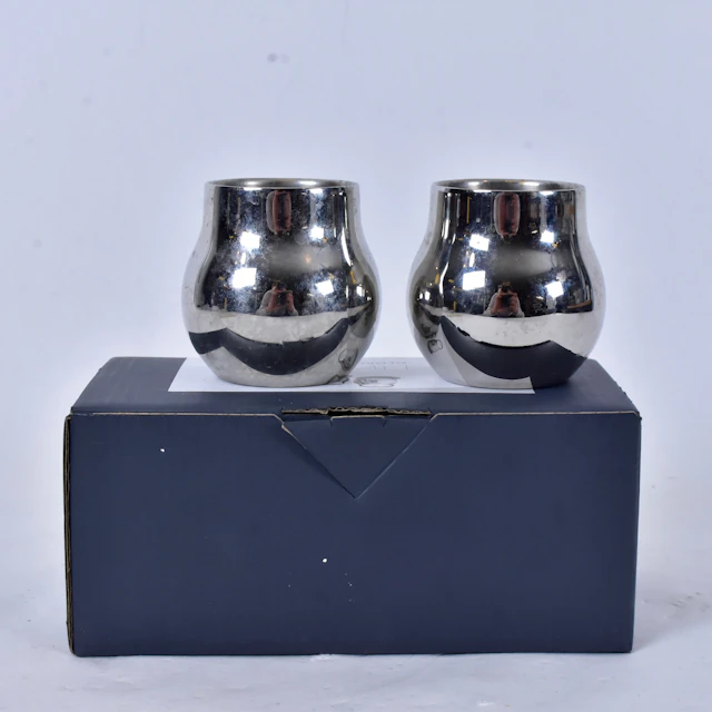 GEORG JENSEN. ljuslyktor, 1 par, rostfritt stål.