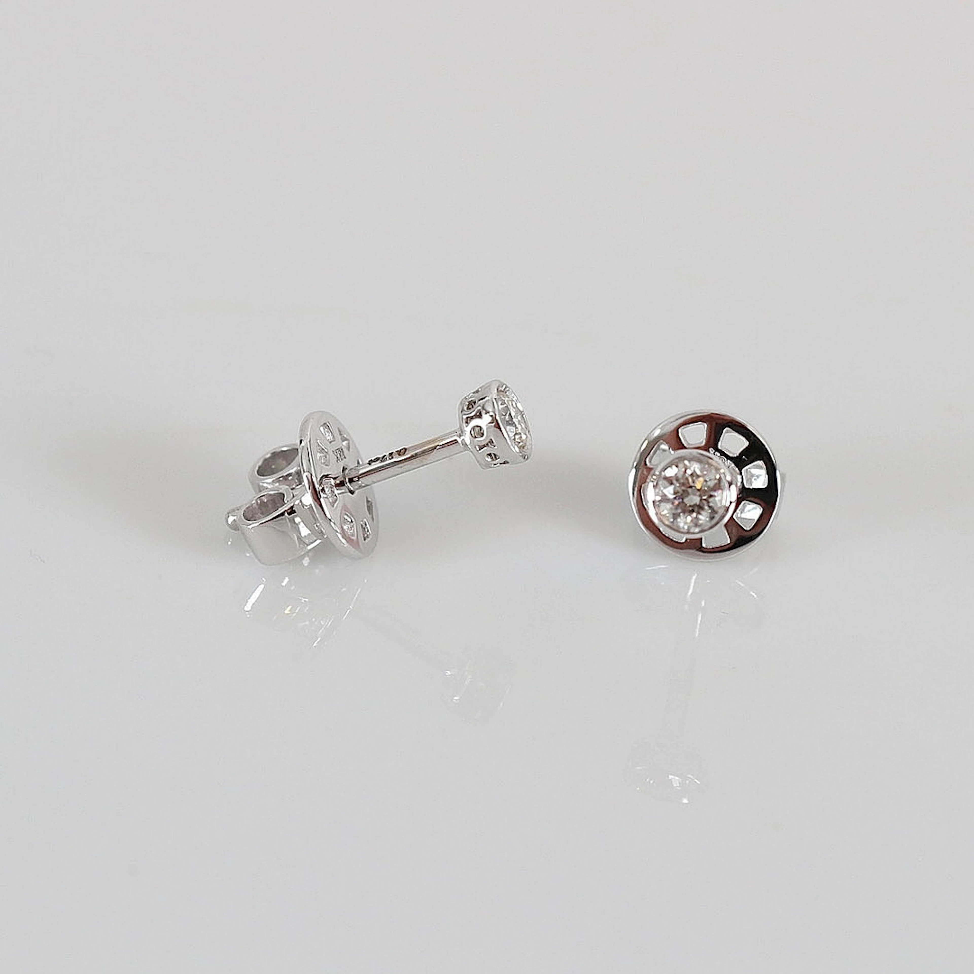 ENSTENSÖRHÄNGEN, 0,16ct, vitguld 18K.