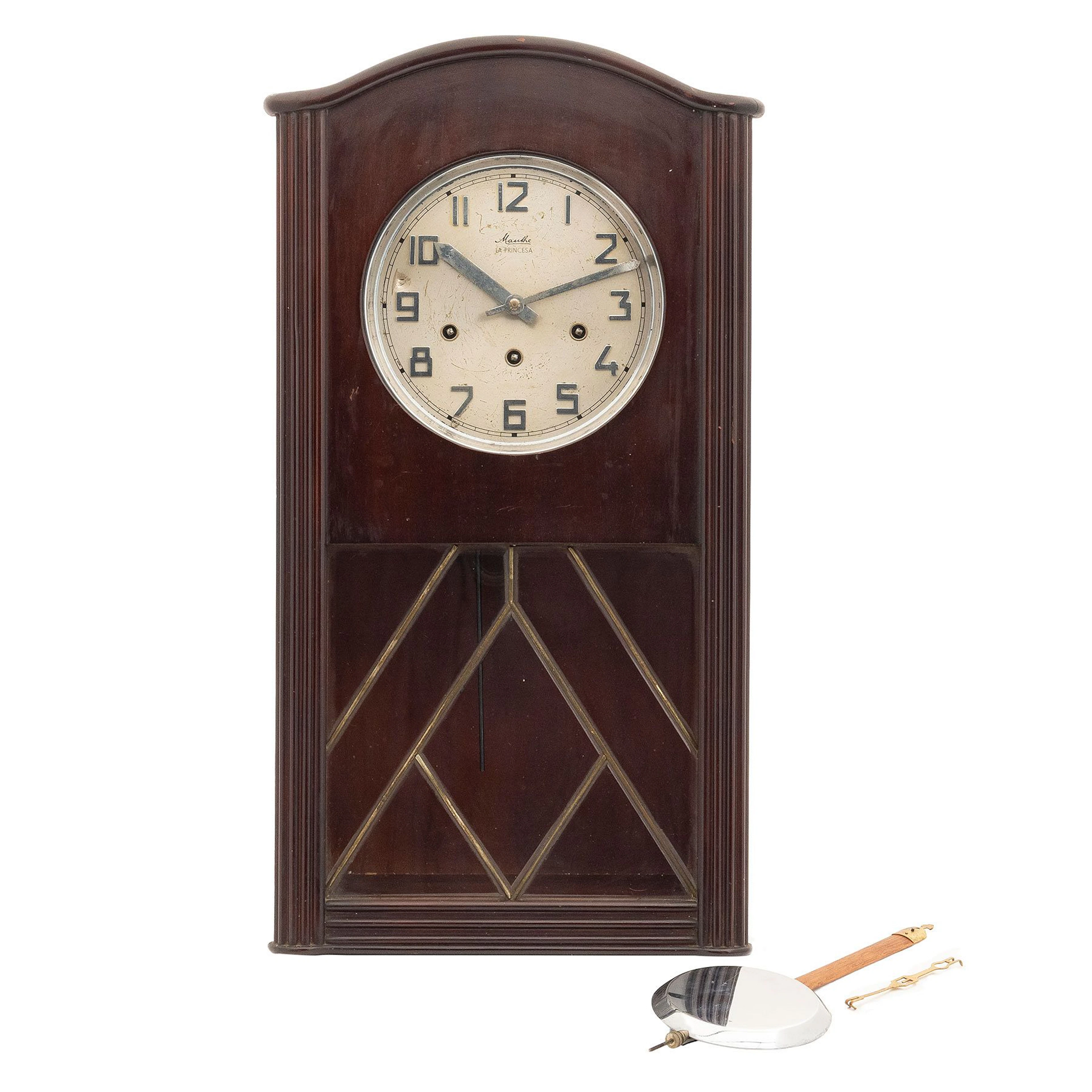 RELOJ DE PARED ALEMANIA, SIGLO XX Elaborado en madera y metal, con