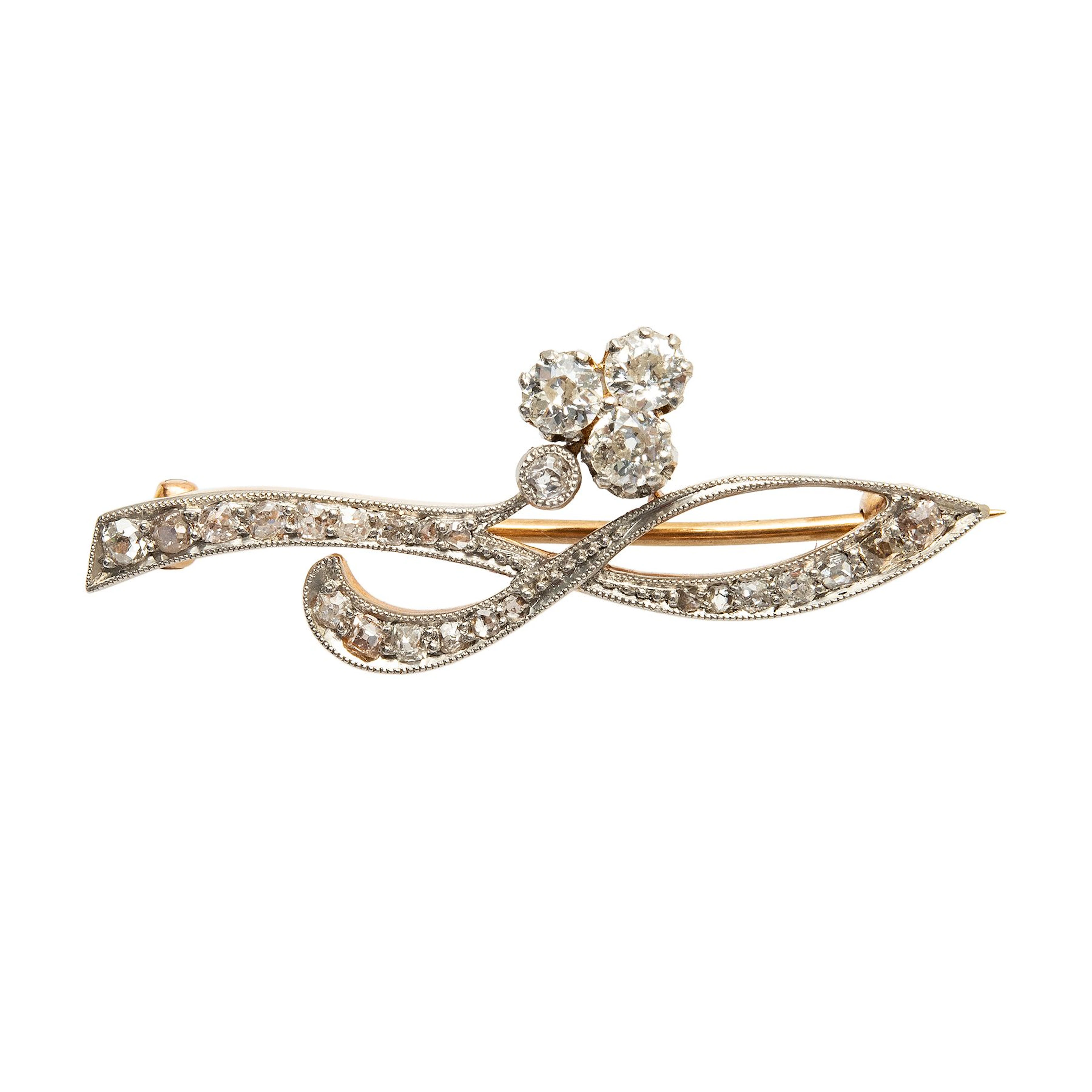 PRENDEDOR CON DIAMANTES EN ORO AMARILLO DE 12K Y PLATINO