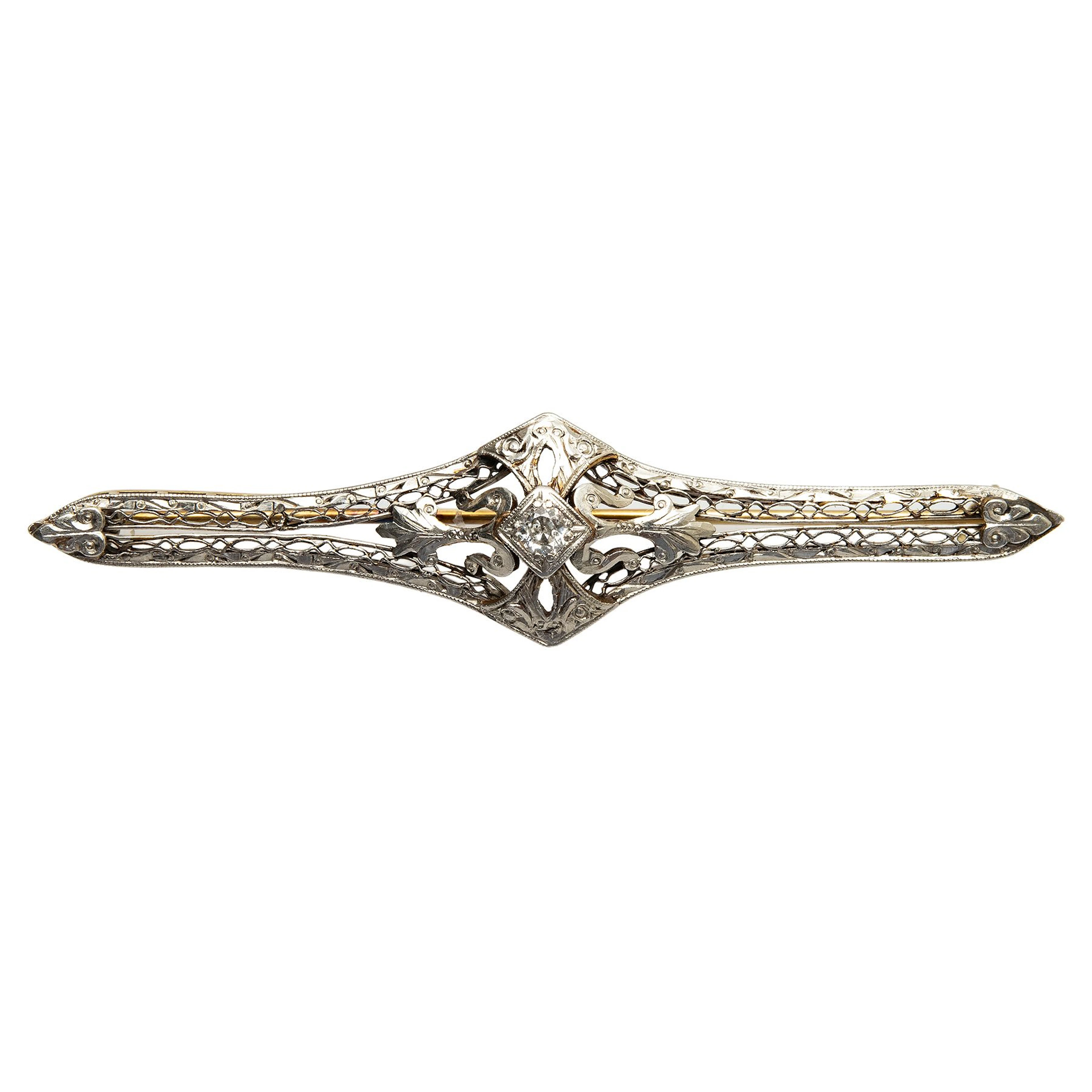 PRENDEDOR CON DIAMANTE EN ORO AMARILLO DE 14K Y PLATINO
