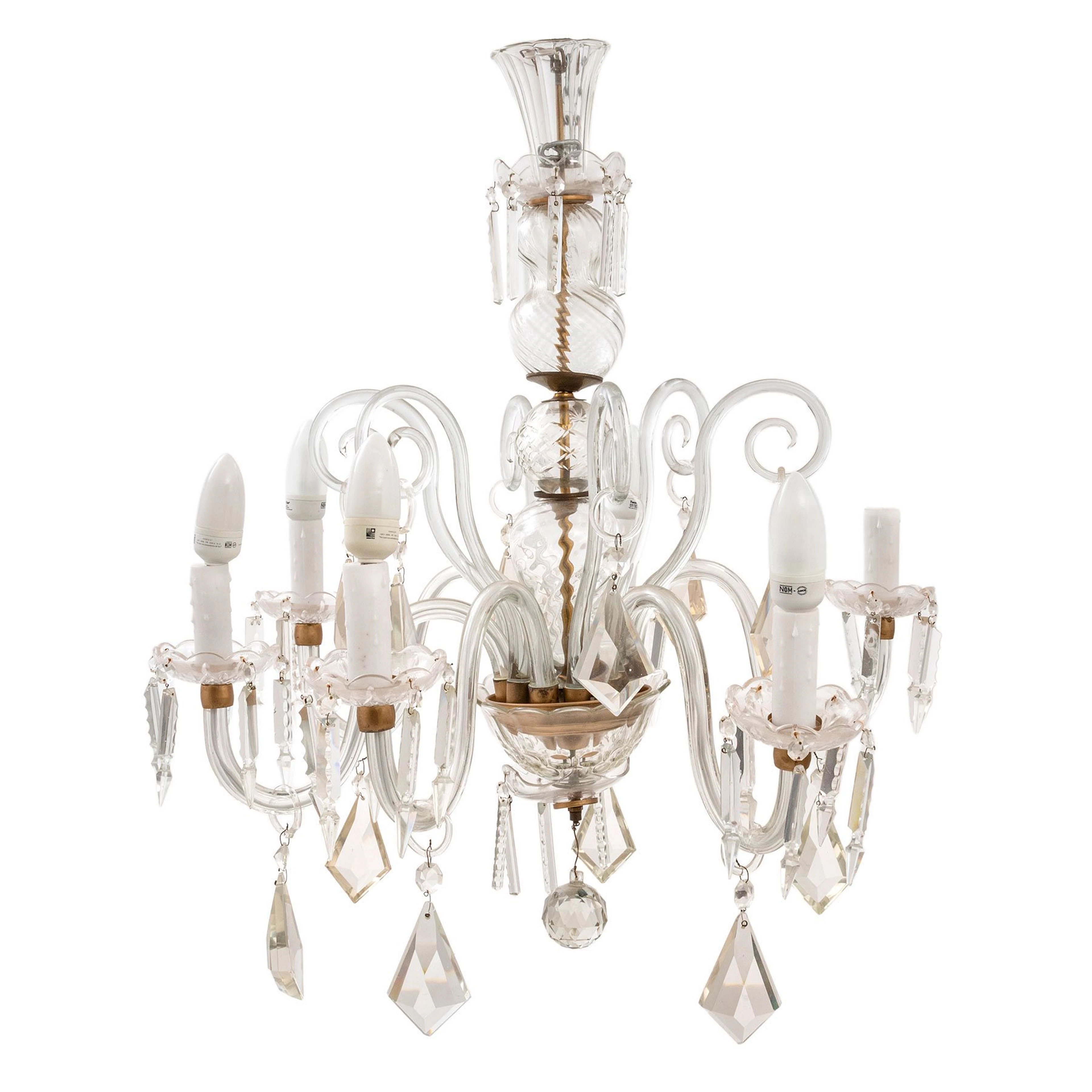 CANDIL, SXX. En cristal transparente y metal. Fuste torneado, brazos