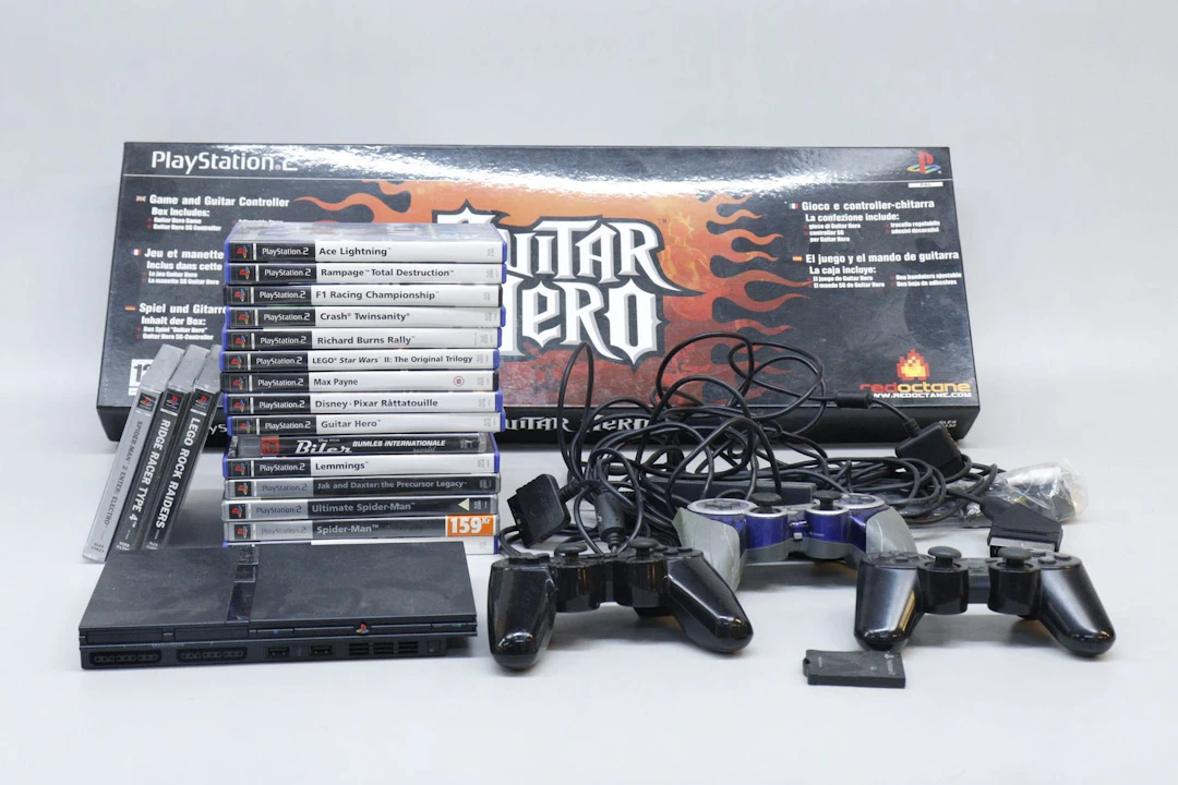 Playstation 2 med guitar hero, spel och tillbehör