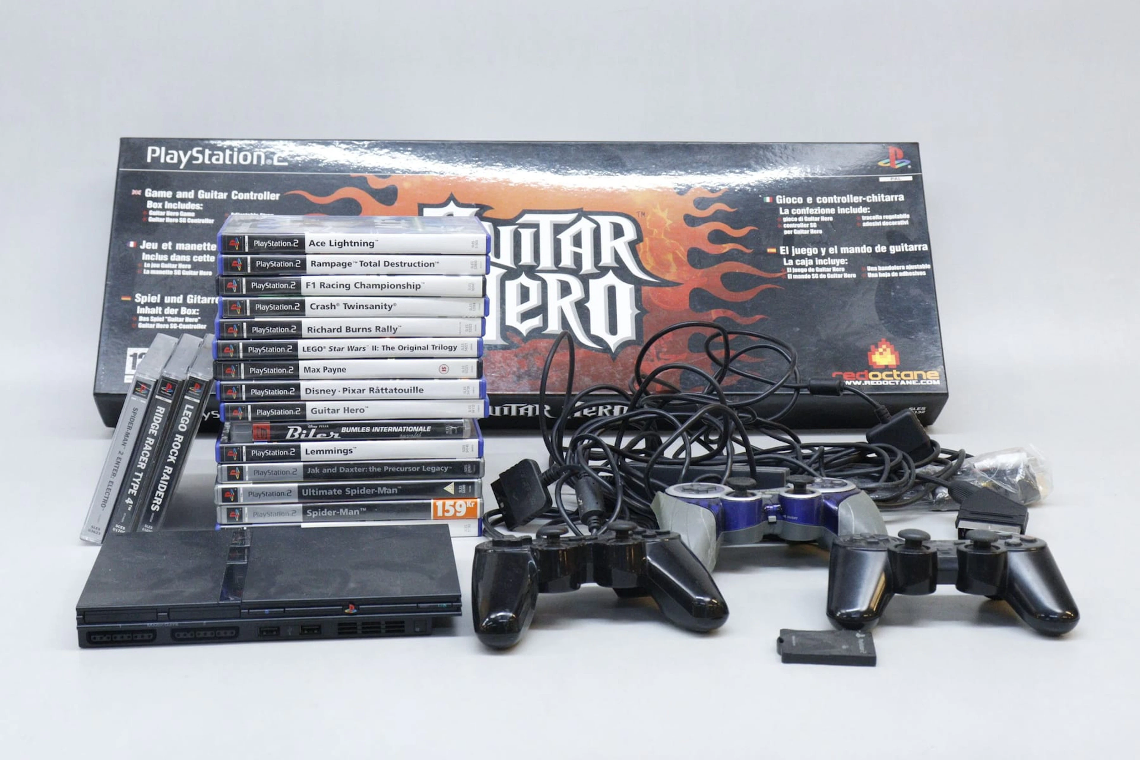 Playstation 2 med guitar hero, spel och tillbehör