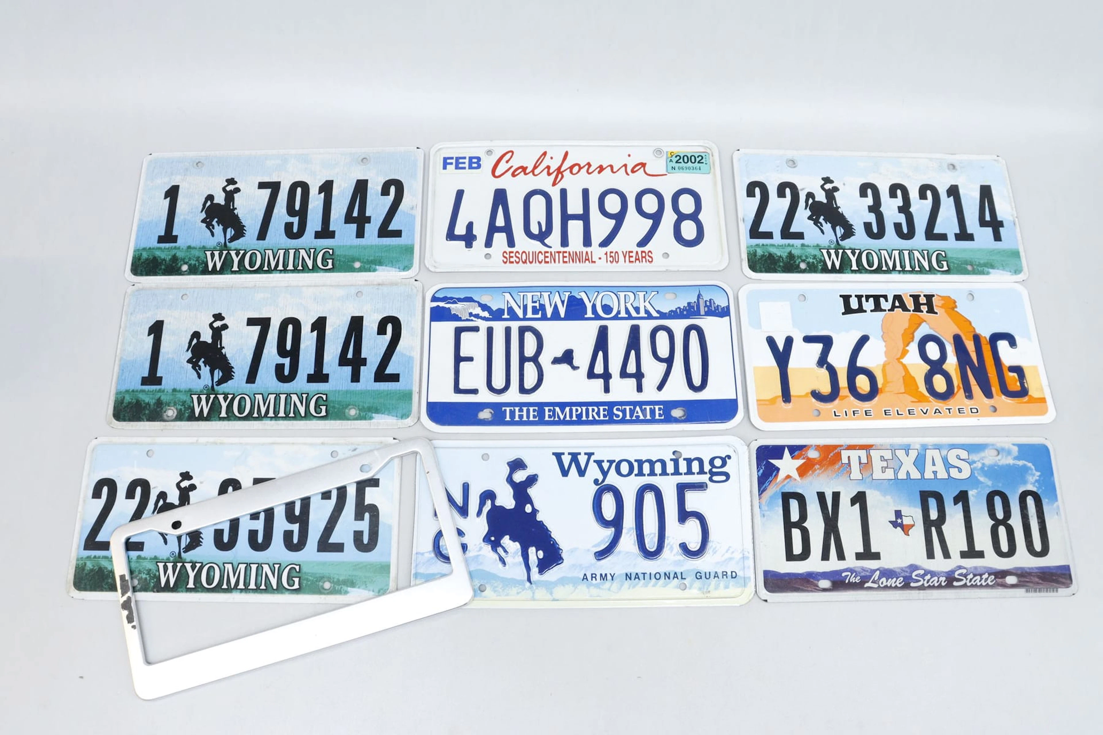 Amerikanska registreringsskyltar, 9st, Texas, New York, Wyoming mm