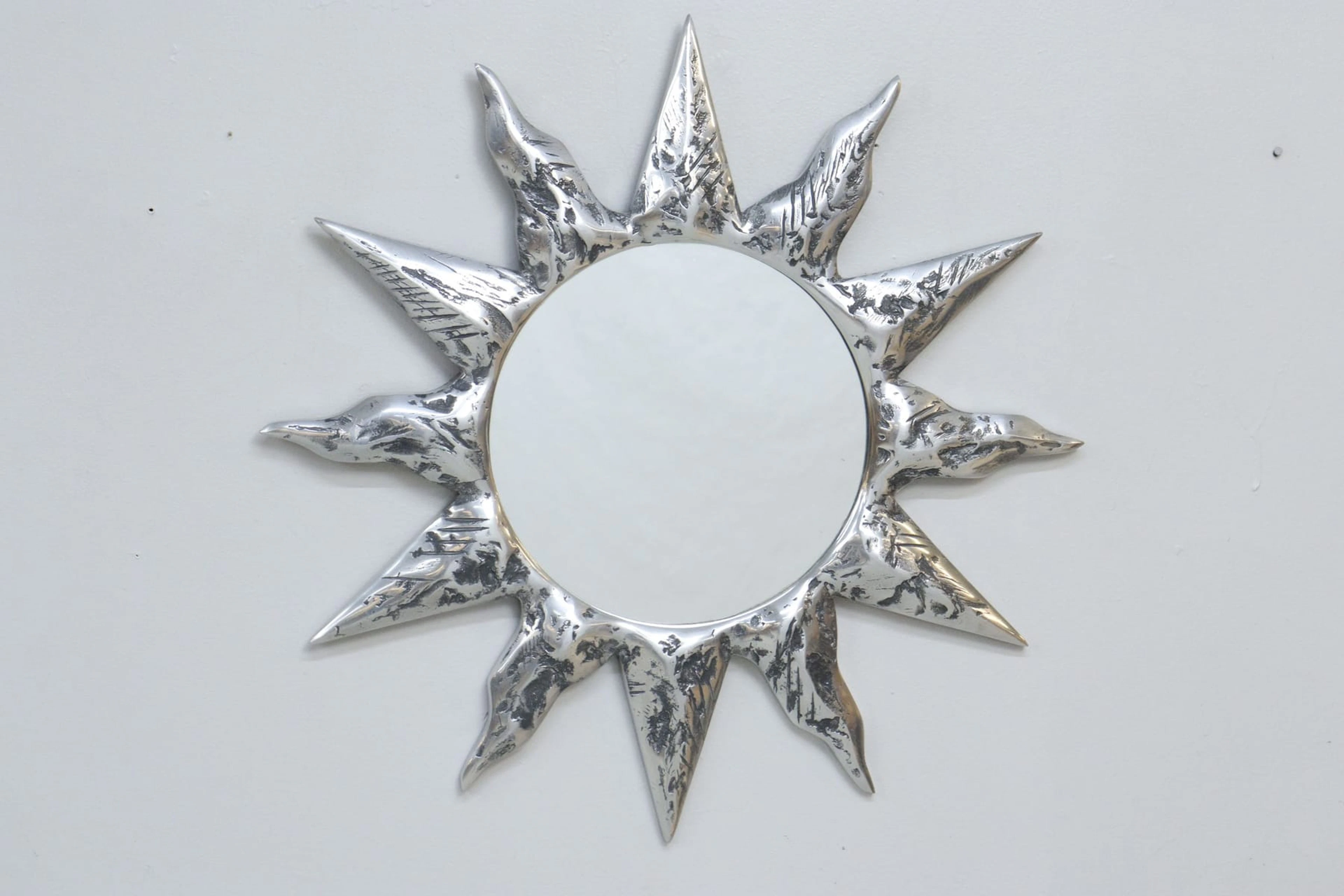 Solspegel, vitmetall