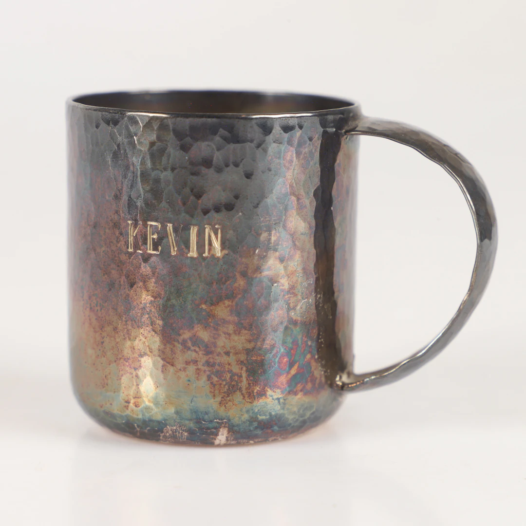 MUGG, sterlingsilver med hamrad dekor.