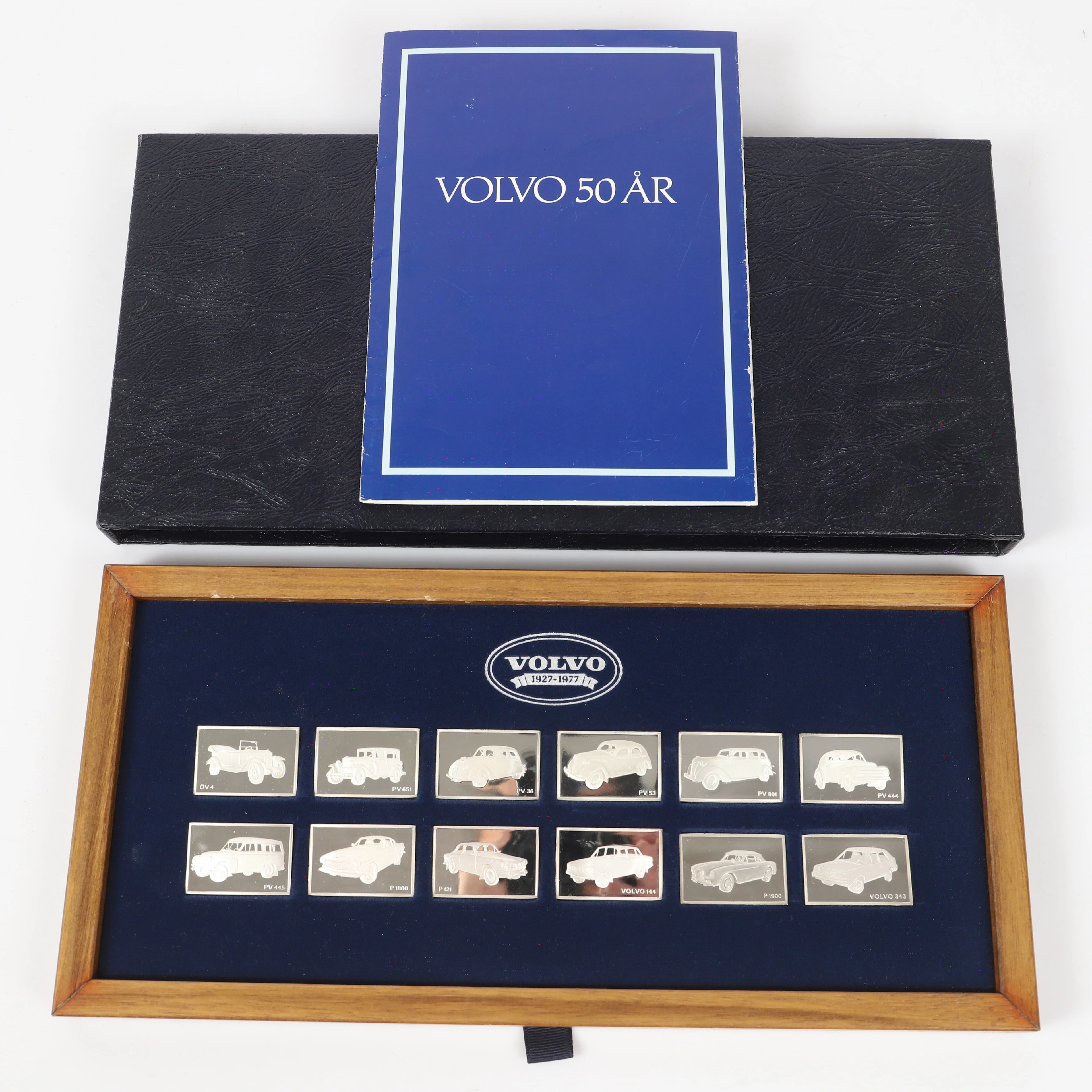 PLAKETTER, 12 stycken i etui, "Volvo 50 år", sterlingsilver, Franklin Mint.