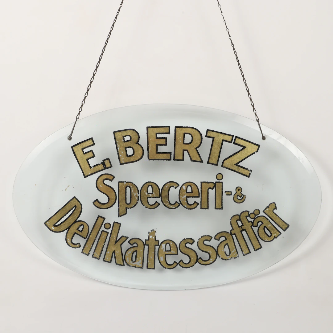 AFFÄRSSKYLT, målat glas, E. Bertz Speceri-& Delikatessaffär.