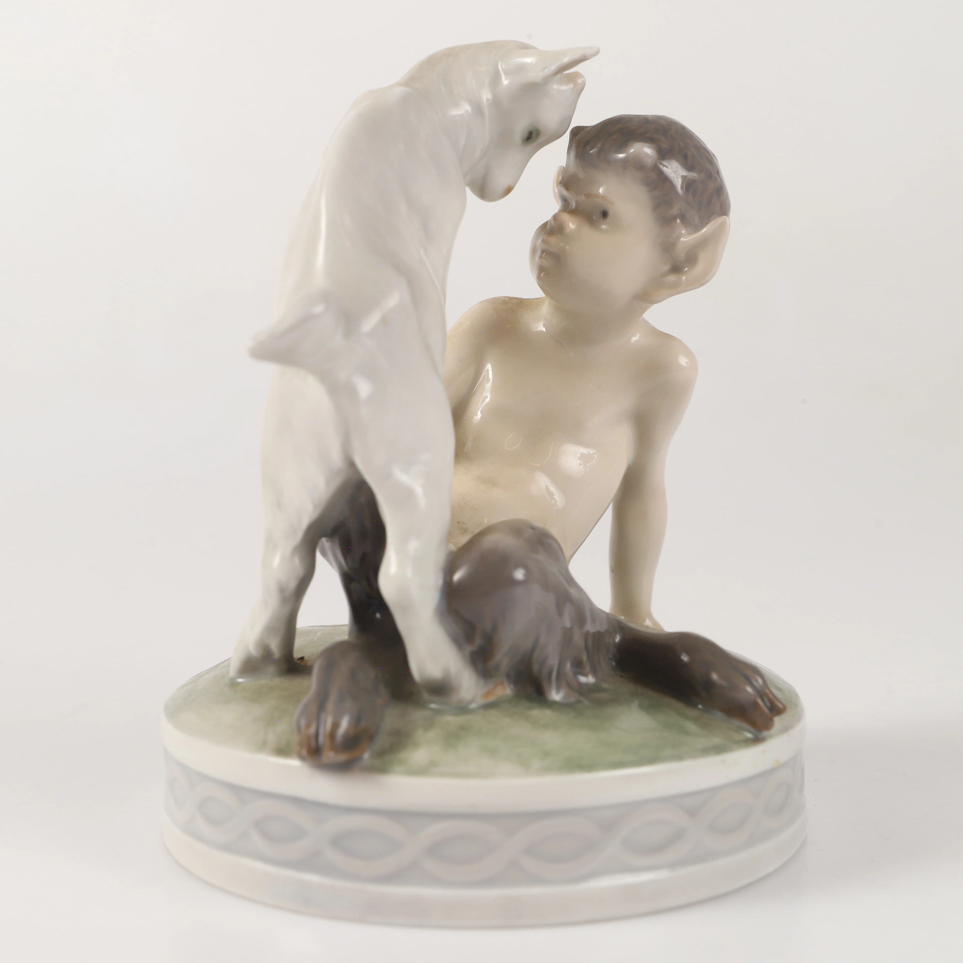 CHRISTIAN THOMSEN. Figurin, faun med get, porslin, Royal Copenhagen, Danmark.