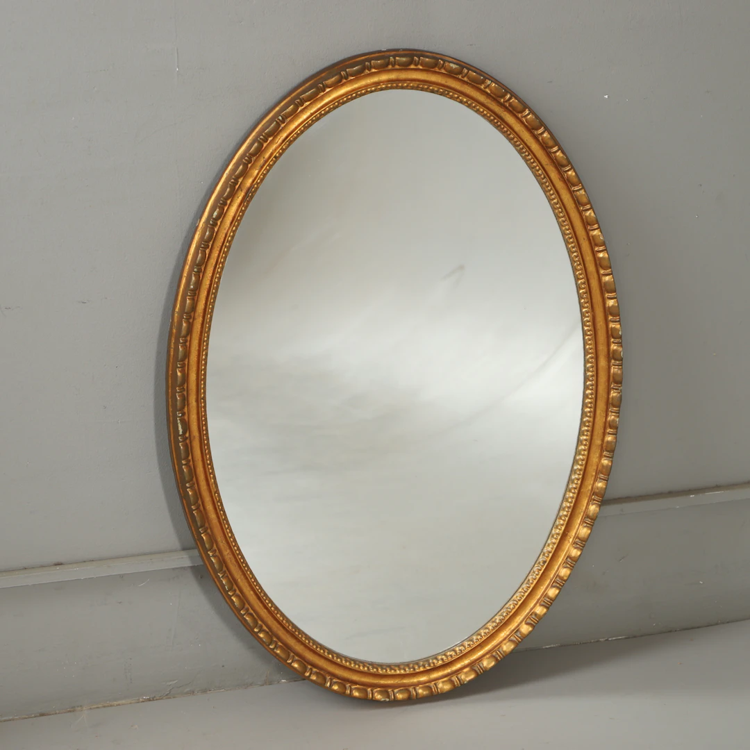 SPEGEL, förgylld, oval, 2000-tal.