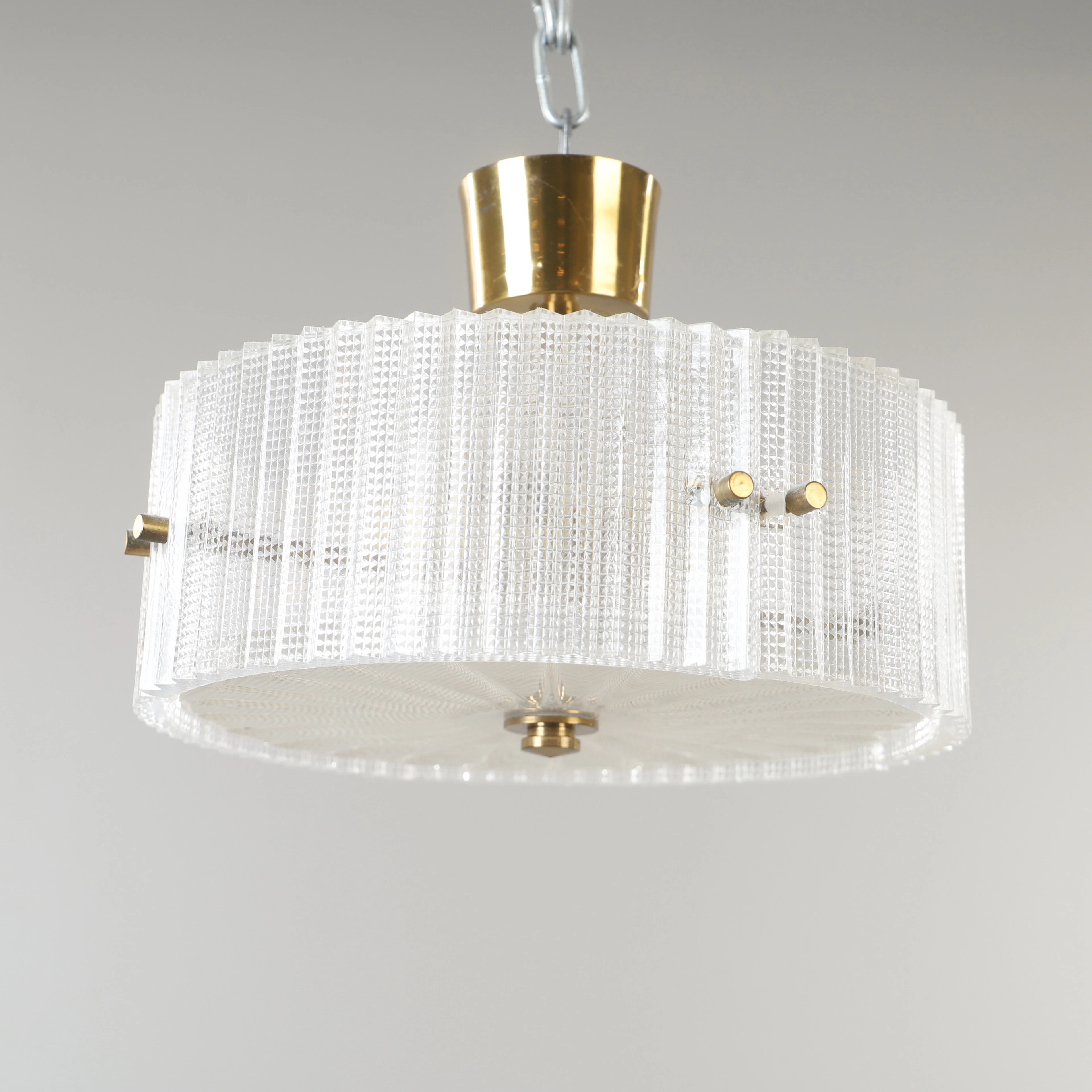 CARL FAGERLUND. Taklampa, mässing och glas, Orrefors.