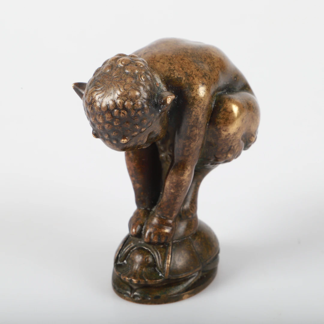 SIGILL, brons i form faun.
