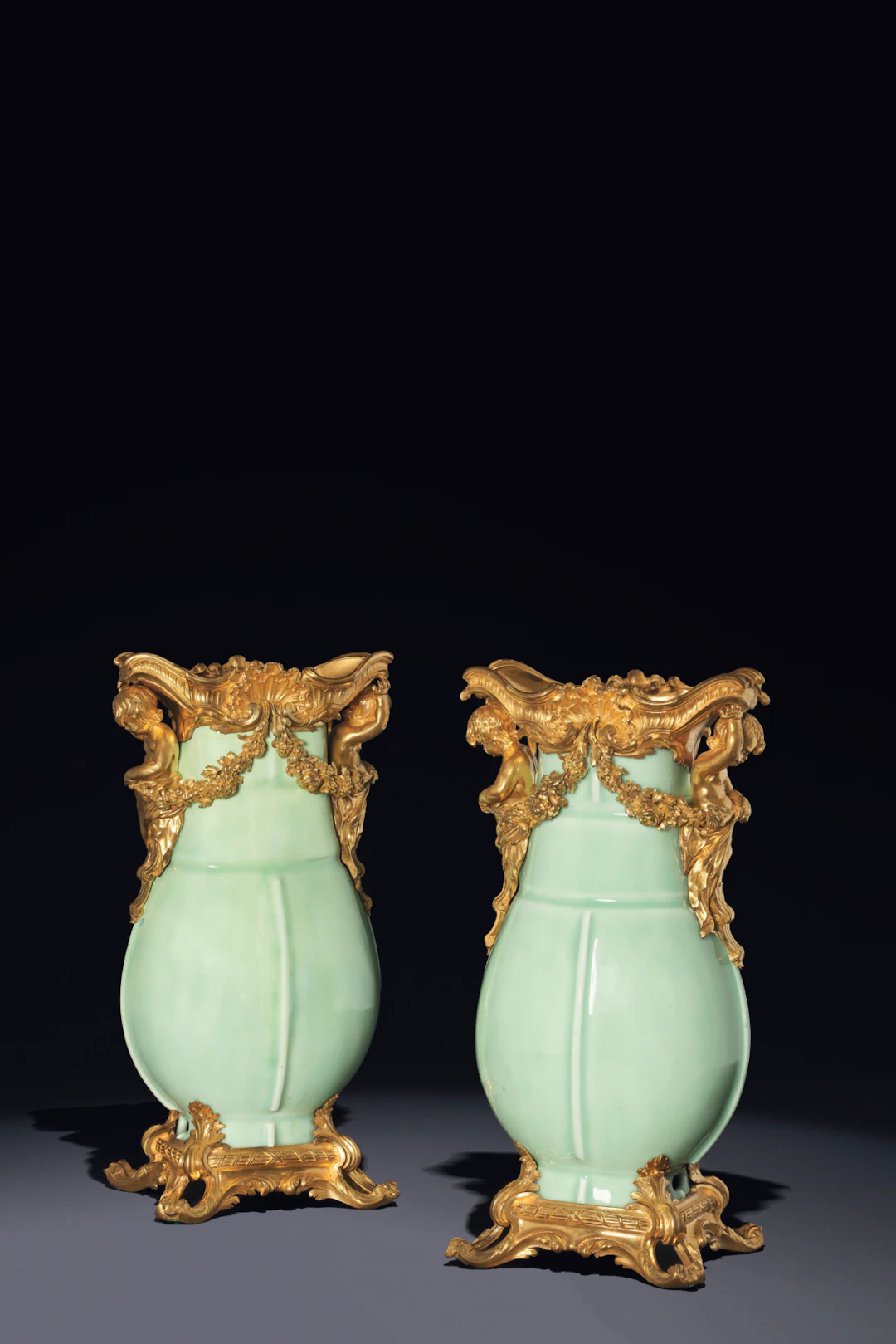 A PAIR OF LOUIS XV ORMOLU AND CHINESE CLAIR DE LUNE CELADON PORCELAIN VASES