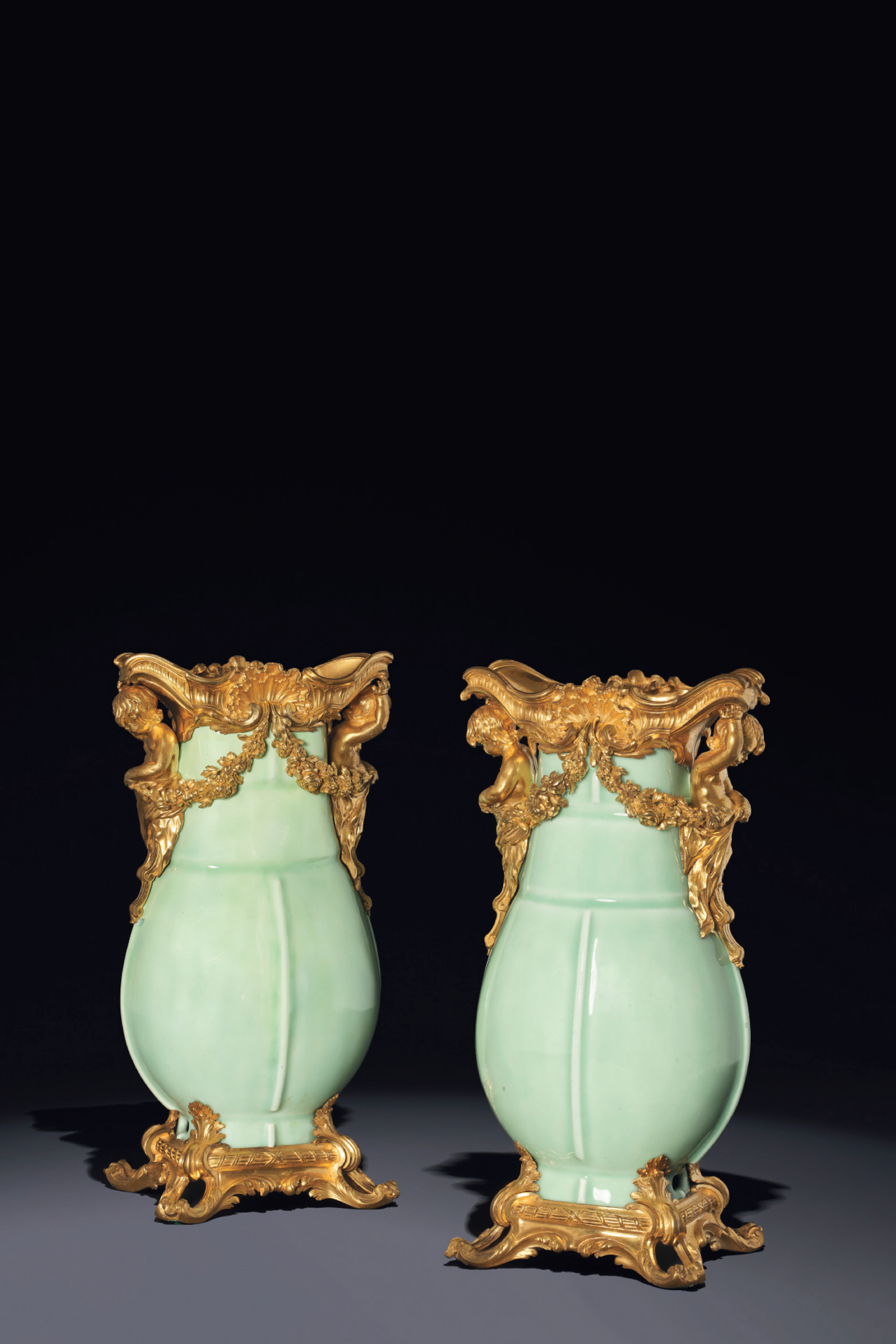A PAIR OF LOUIS XV ORMOLU AND CHINESE CLAIR DE LUNE CELADON PORCELAIN VASES