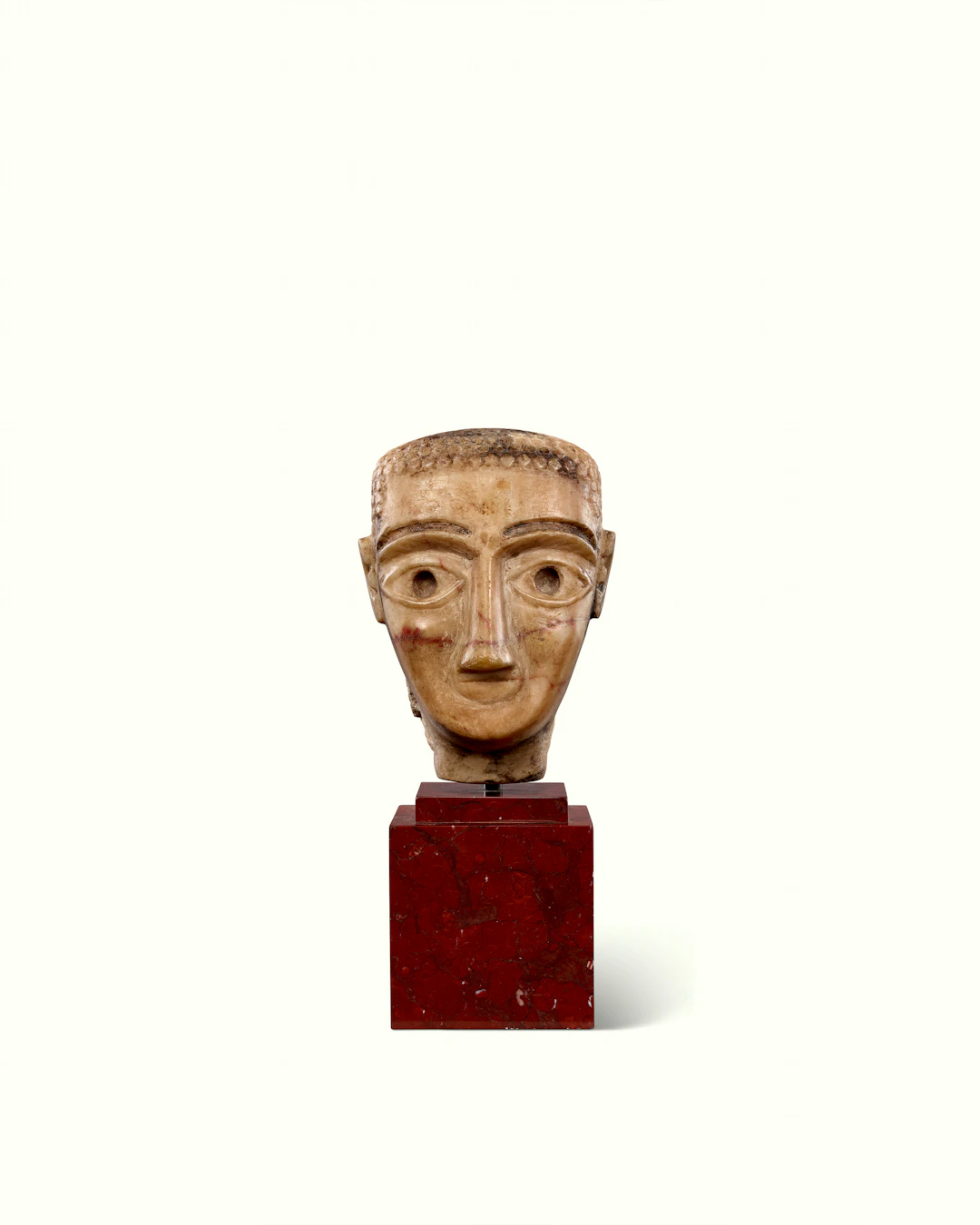 A SOUTH ARABIAN ALABASTER PORTRAIT HEAD OF A MAN