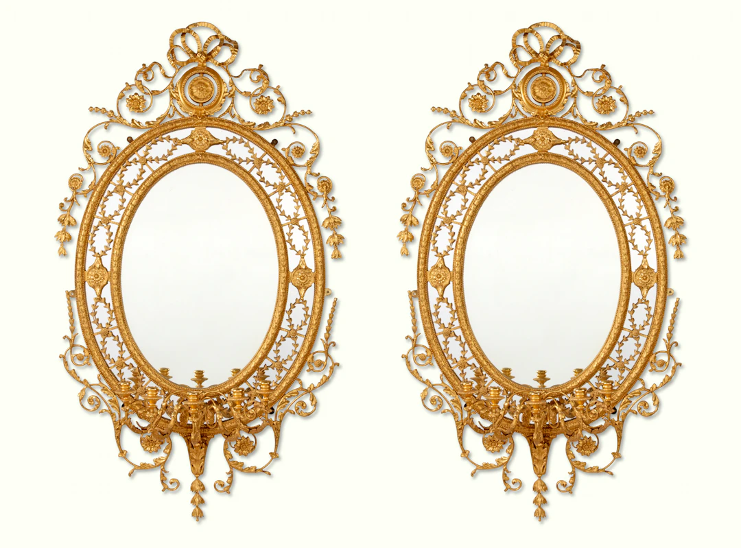 A PAIR OF VICTORIAN GILTWOOD AND GILT-COMPOSITION FIVE-LIGHT OVAL GIRANDOLES