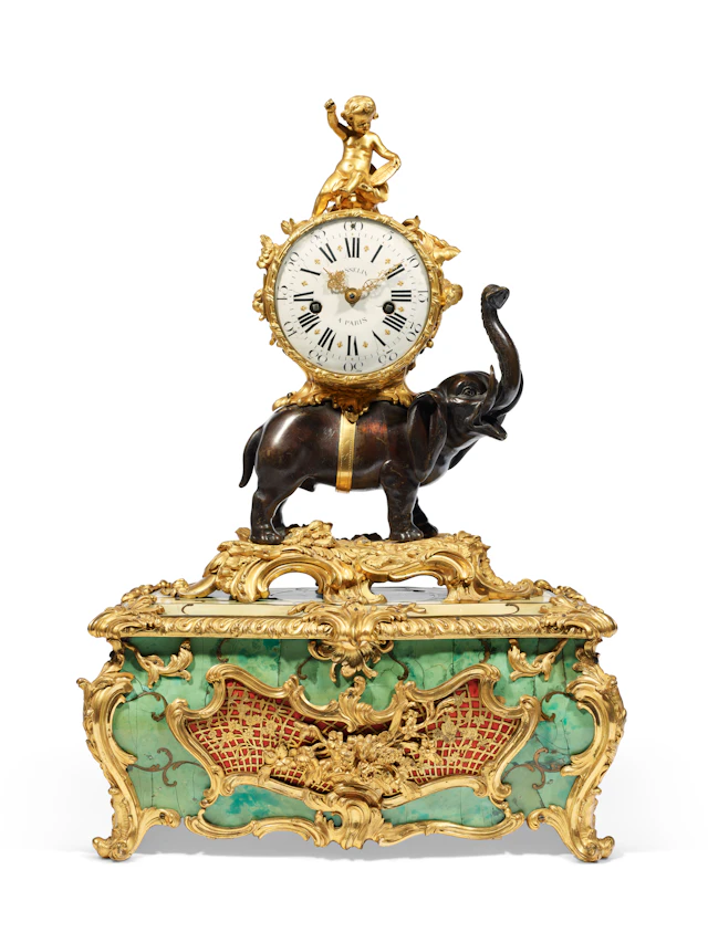 A LOUIS XV GILT AND PATINATED BRONZE ELEPHANT CLOCK WITH A MUSICAL BOX
