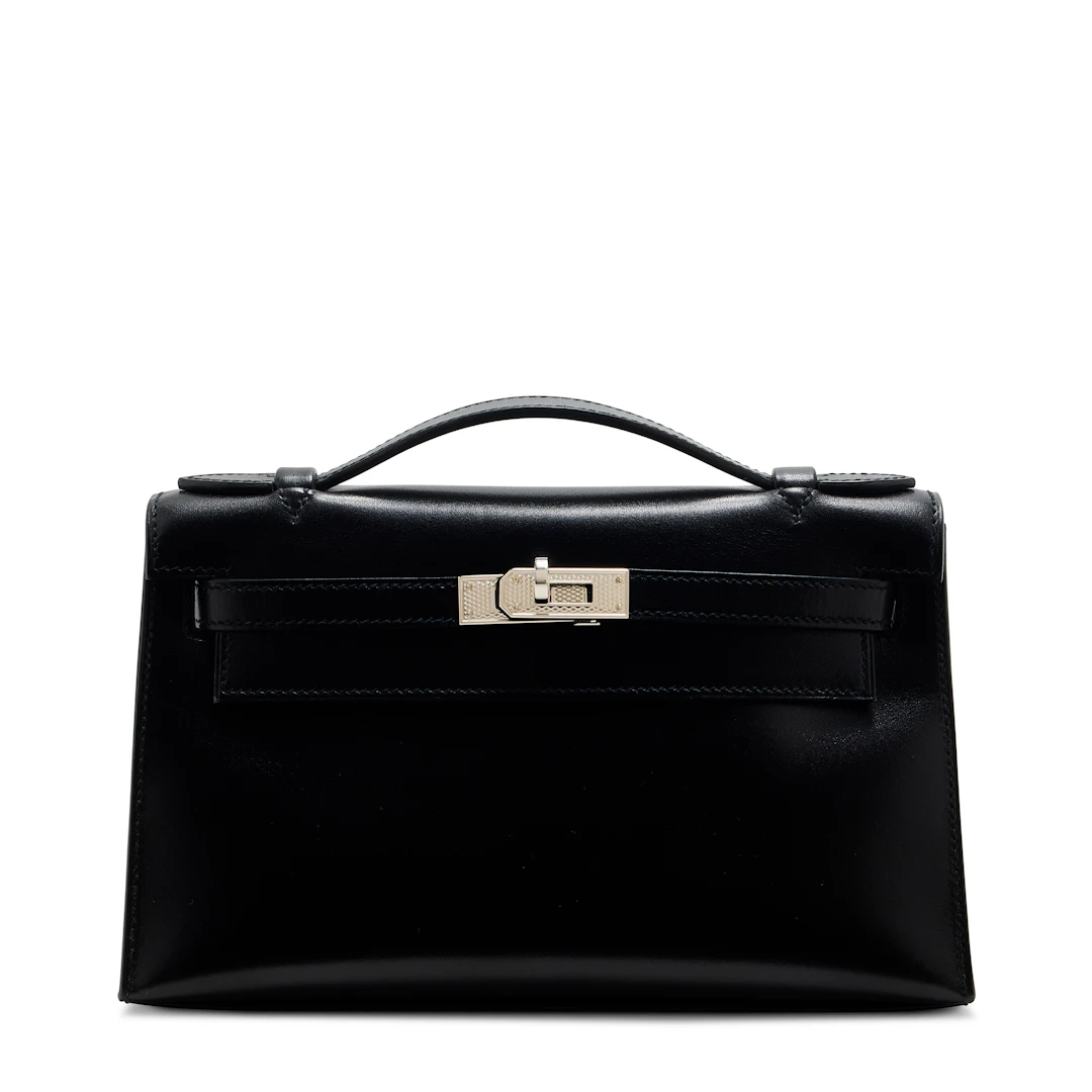 A LIMITED EDITION BLACK CALF BOX LEATHER KELLY POCHETTE WITH GUILLOCHÉ