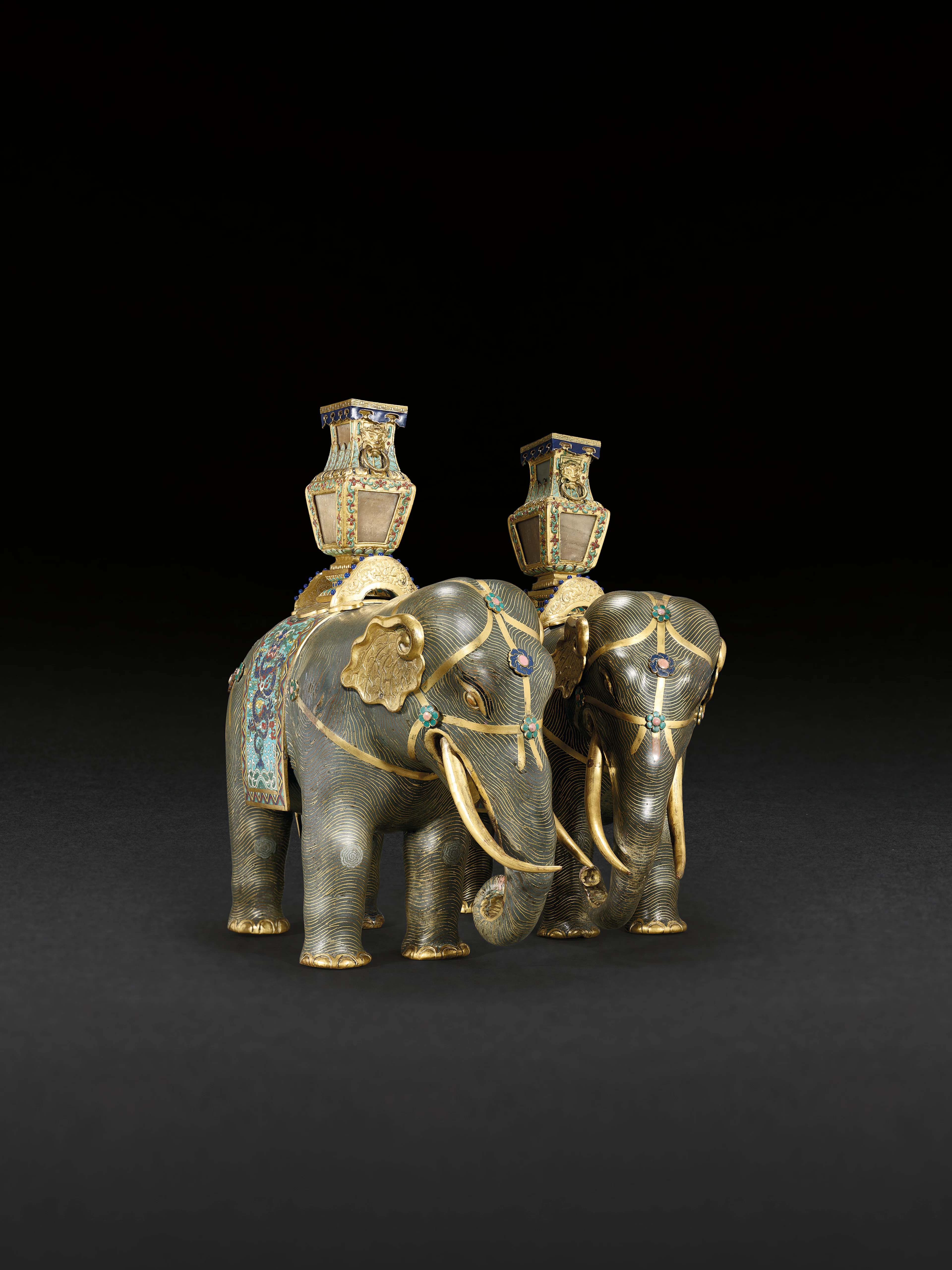 A MAGNIFICENT PAIR OF CLOISONNÉ ENAMEL FIGURES OF CAPARISONED ELEPHANTS