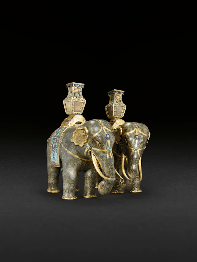 A MAGNIFICENT PAIR OF CLOISONNÉ ENAMEL FIGURES OF CAPARISONED ELEPHANTS
