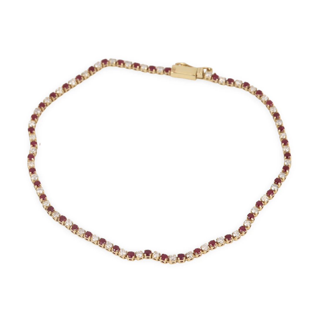 14CT GOLD RUBY & DIAMOND BRACELET.