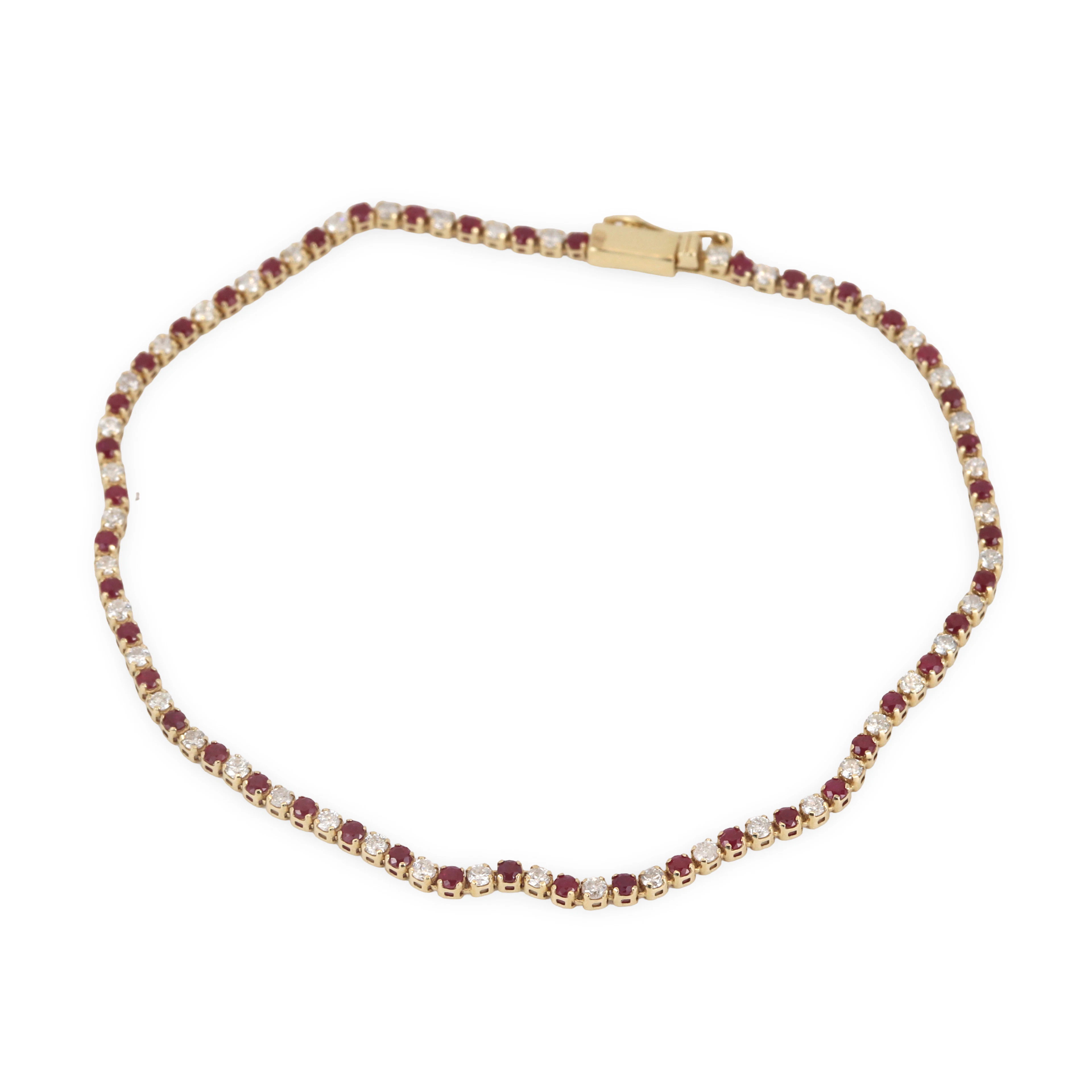 14CT GOLD RUBY & DIAMOND BRACELET.