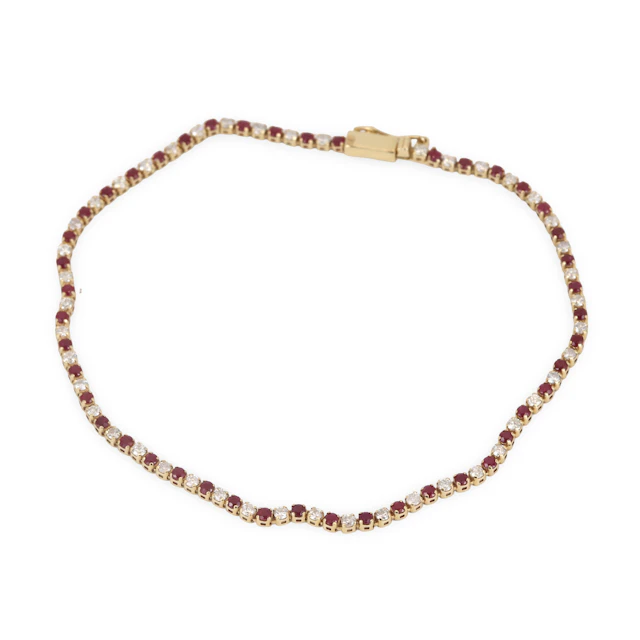 14CT GOLD RUBY & DIAMOND BRACELET.
