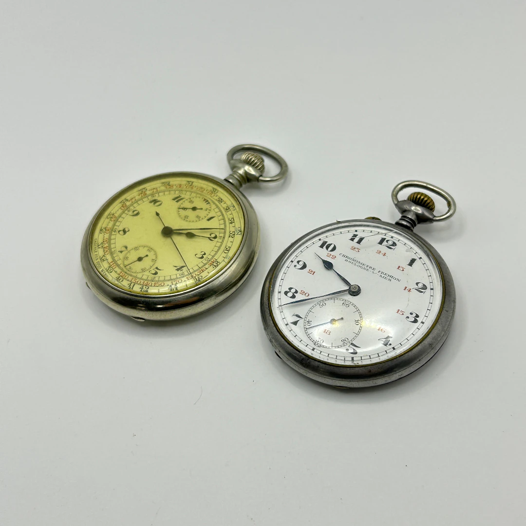 A POCKET WATCH AND A STOPWATCH.