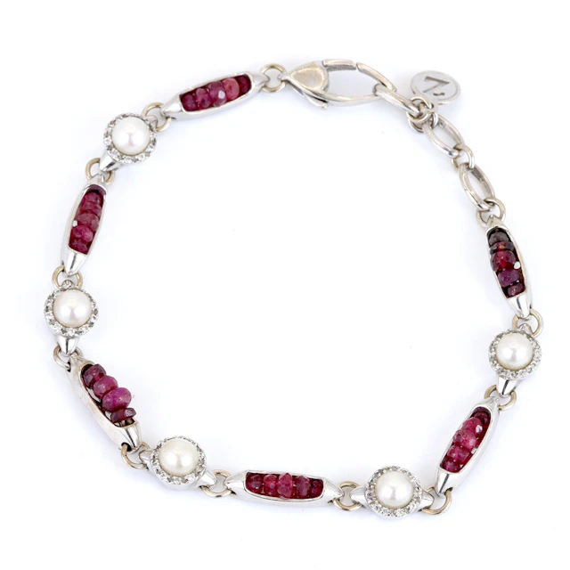 18CT GOLD RUBY, DIAMOND & PEARL BRACELET.