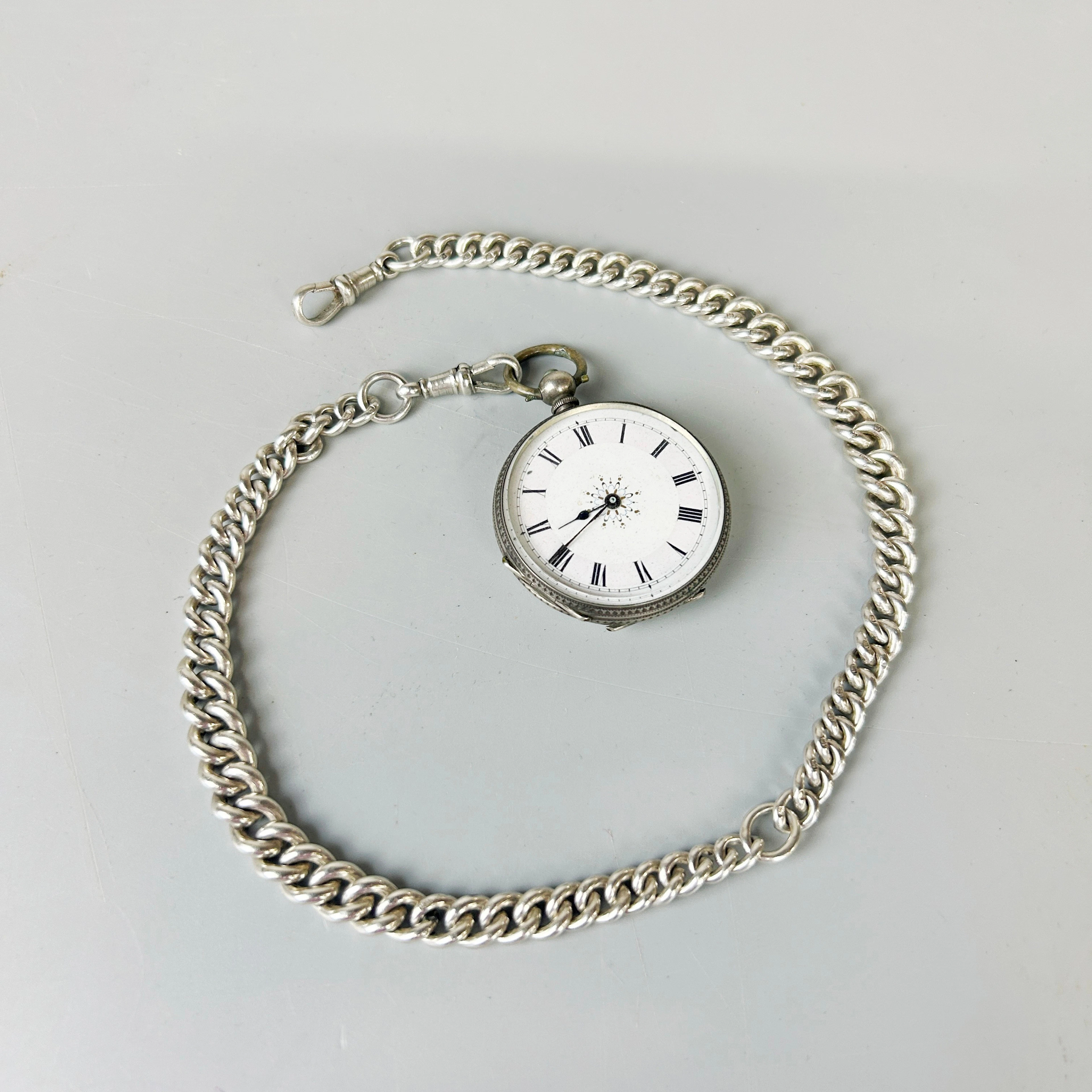 SILVER POCKET WATCH AND CHAIN.