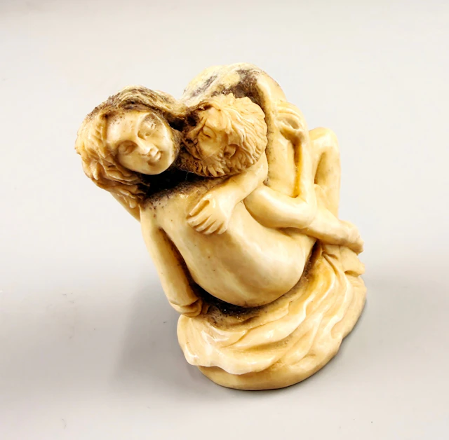 EROTIC ANTLER CARVING.