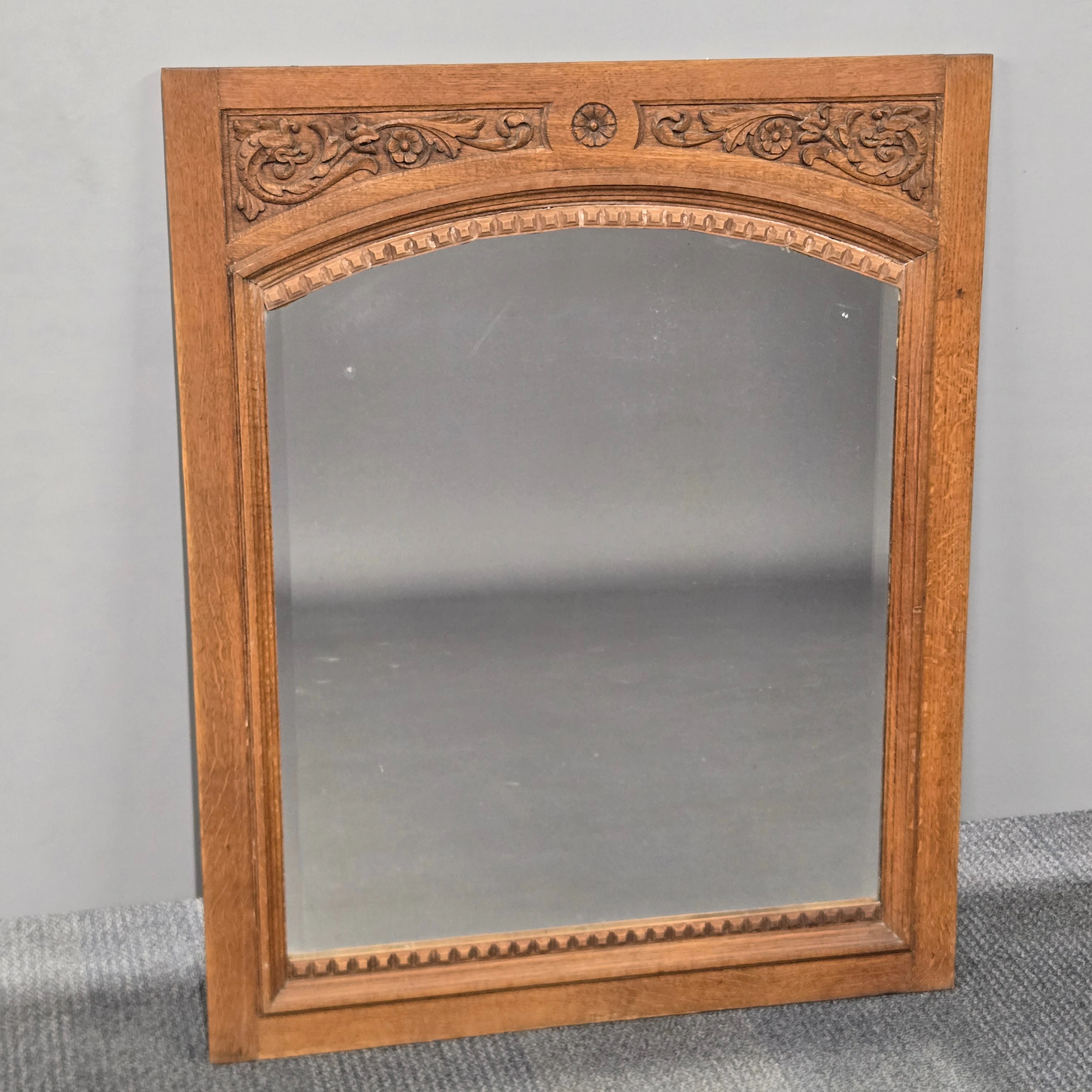 CARVED OAK MIRROR.