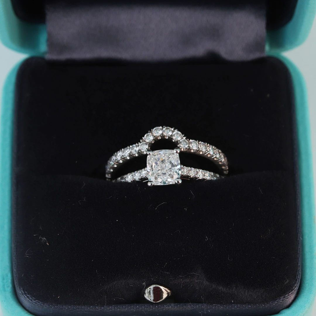 PLATINUM TIFFANY DIAMOND RINGS.